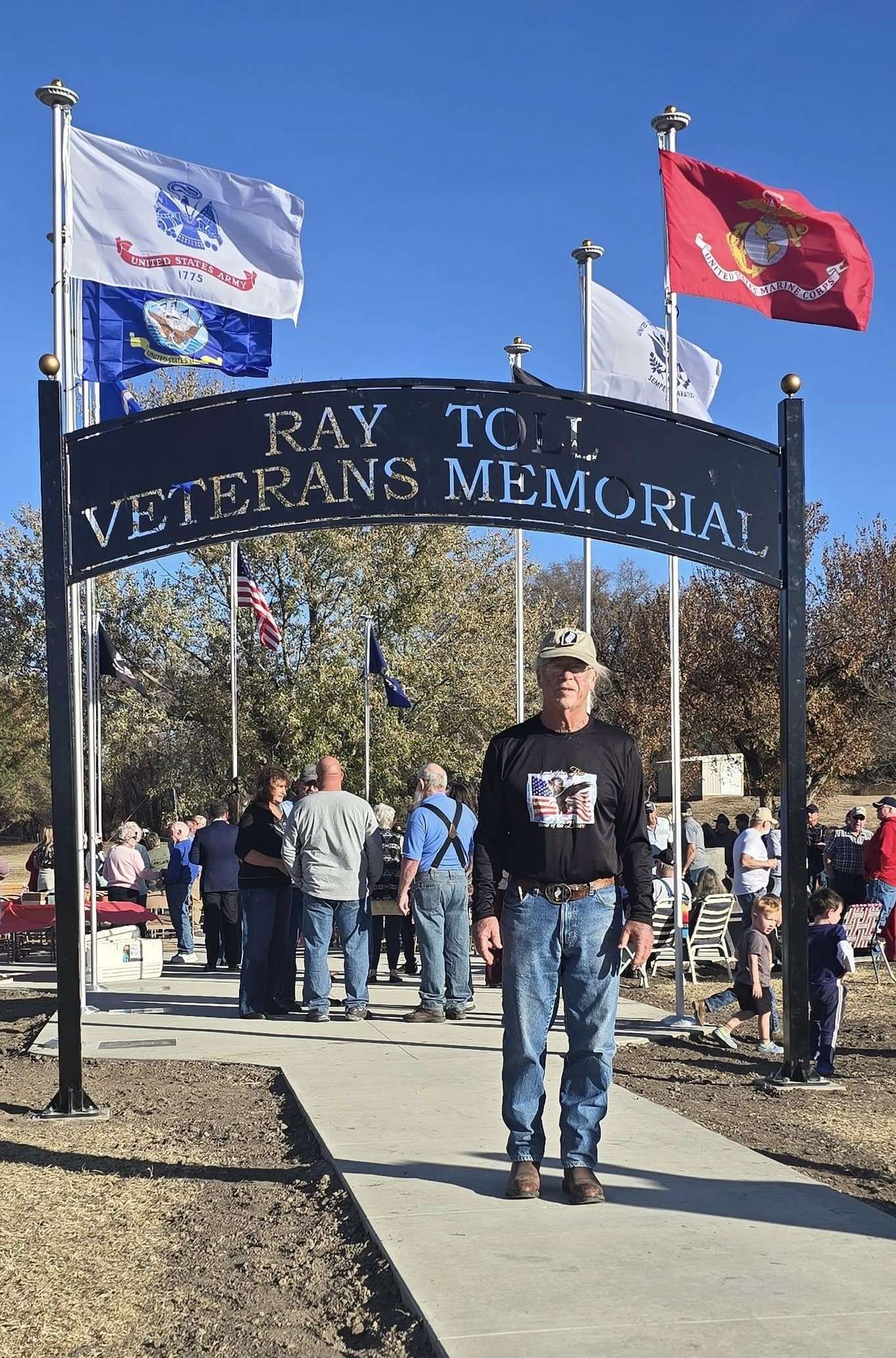 Ray Toll and sign at the Morland Veterans Day dedication. Courtesy photo