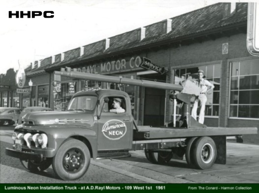 Luminous Neon install truck - front of A.D. Rayl Motors - 1961. Courtesy of the Conard-Harmon Collection.