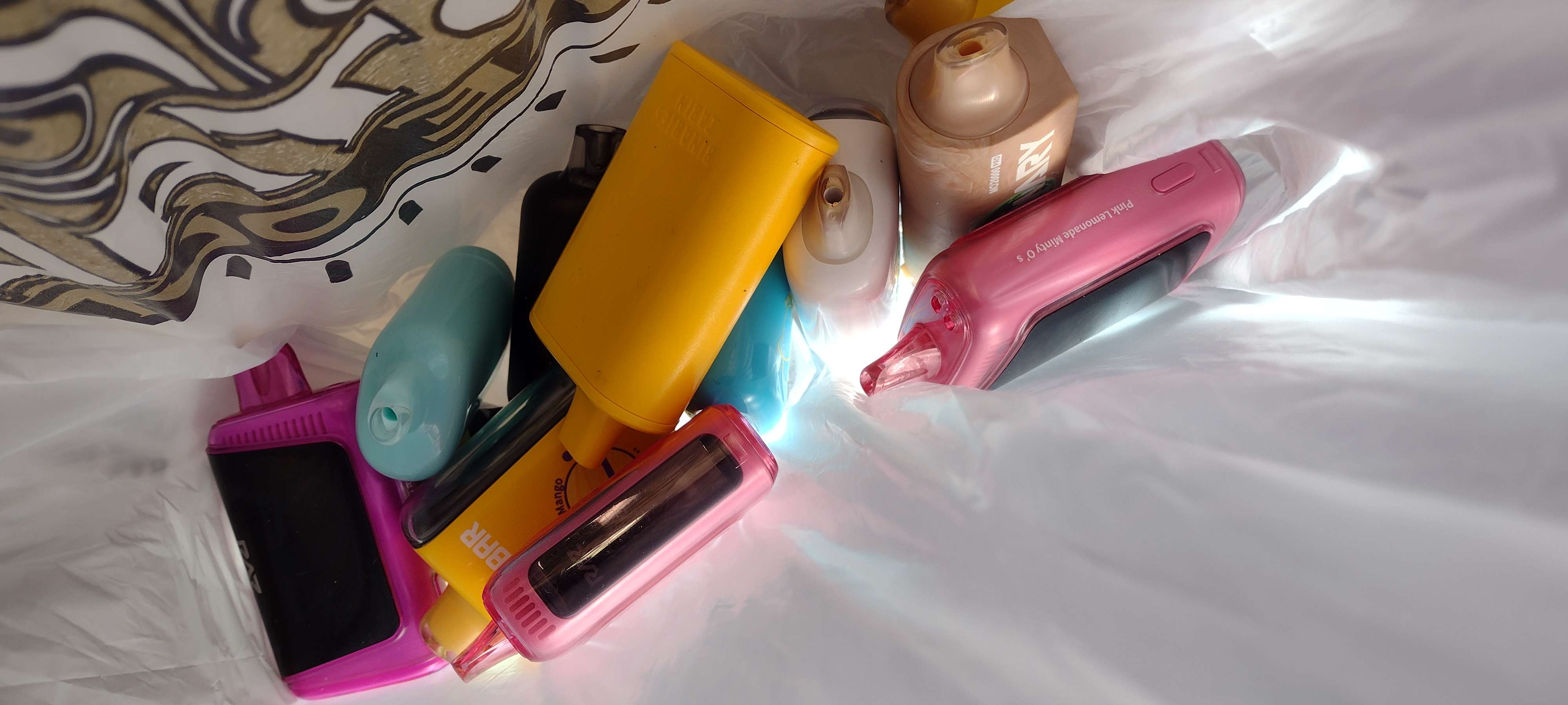 A customer brought a bag of vapes back to recycle at Nebulous Vapor. Packaging tells consumers to recycle and not throw away vapes.