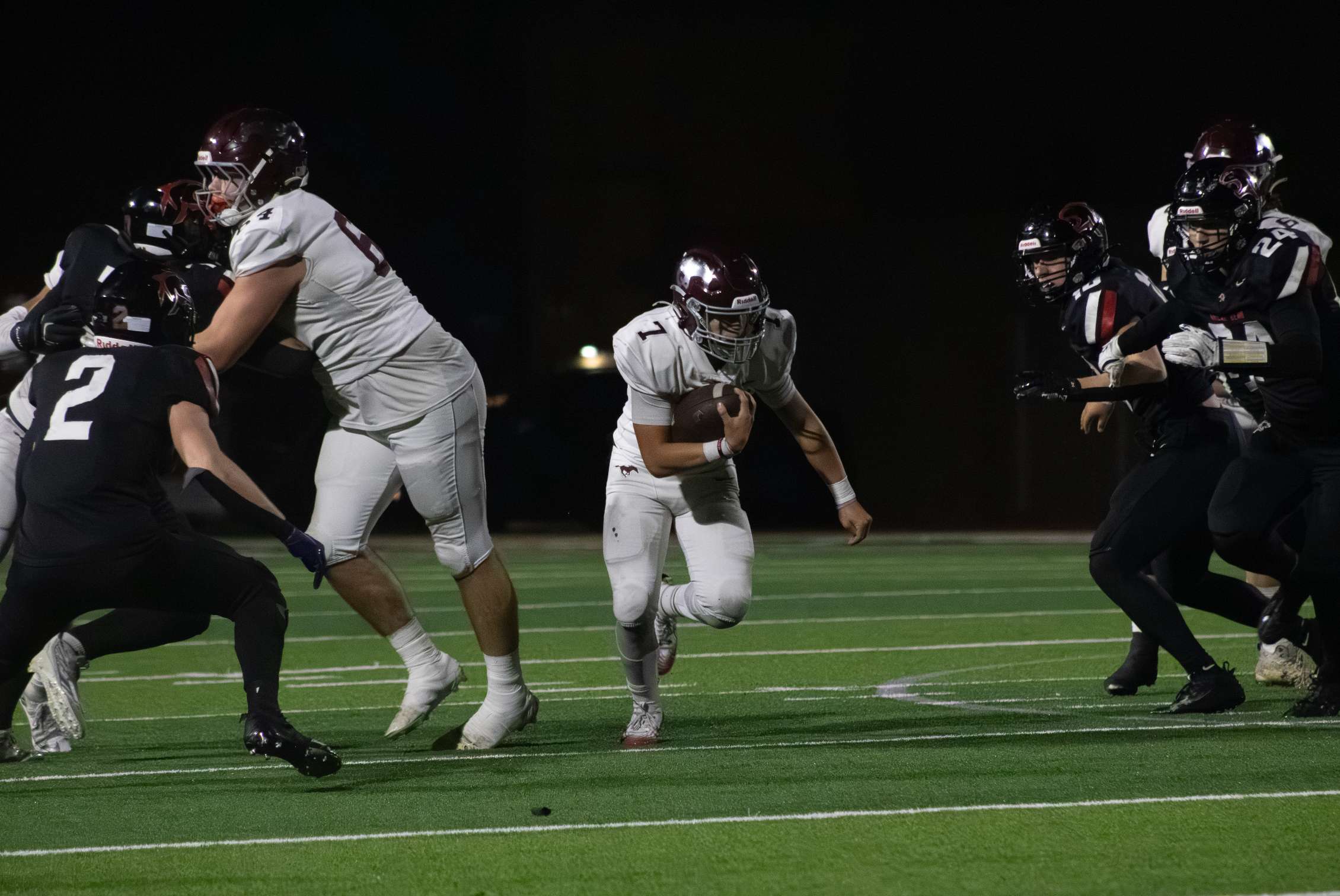 Griffin Hall scampers through the line for a first down. Photo by Kaiden Comeau.