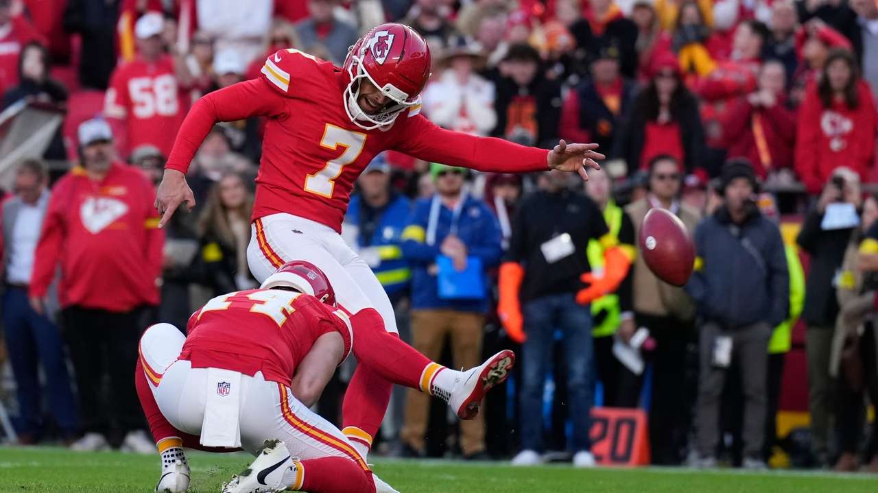 Kansas City Chiefs kicker Harrison Butker (7) kicks a game-winning field goal against the Indianapolis Colts during overtime of an NFL football game Sunday, Nov. 23, 2025, in Kansas City, Mo. (AP Photo/Charlie Riedel)