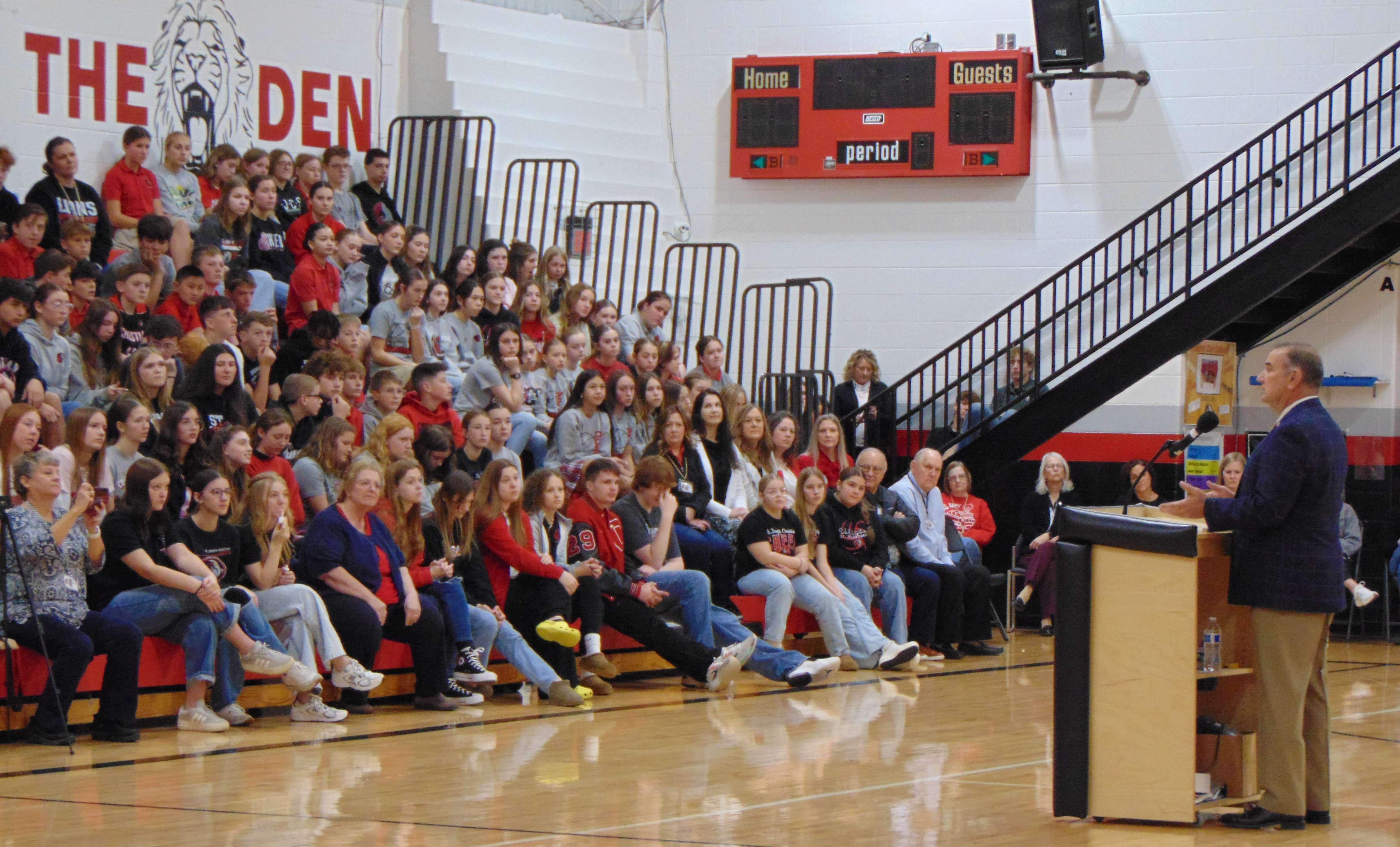 Gov. Mike Kehoe speaks to the assembly at St. Joseph Christian School/Photo by Brent Martin
