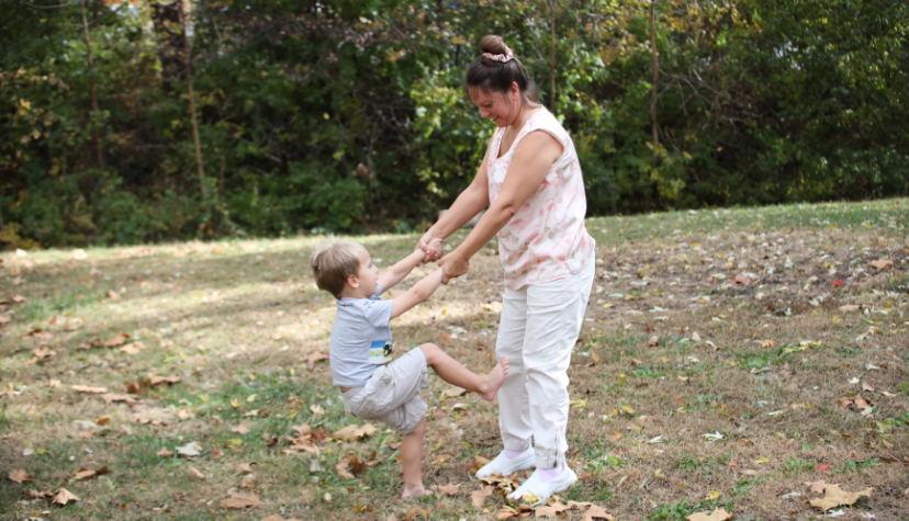 Esther Reddish-Hanner and her son, Alex, play in their backyard in De Soto. Photo by Bek Shackelford-Nwanganga/Kansas News Service