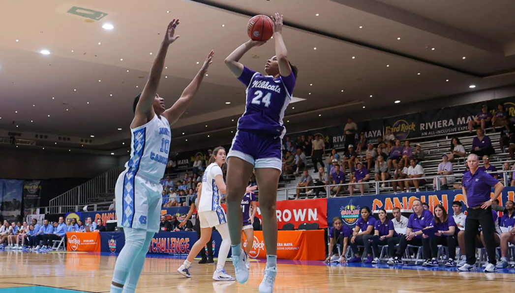 K-State's Jenessa Cotton goes up against UNC's on Nov. 28, 2025 at the Cancun Invitational. (Photo courtesy of K-State Athletic Communications)