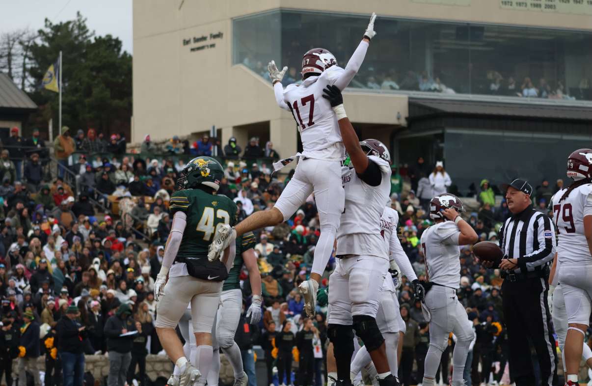 A Mustang OL hoists Elijah Duxler in the air following a big Central touchdown - Photo by Kaiden Comeau.
