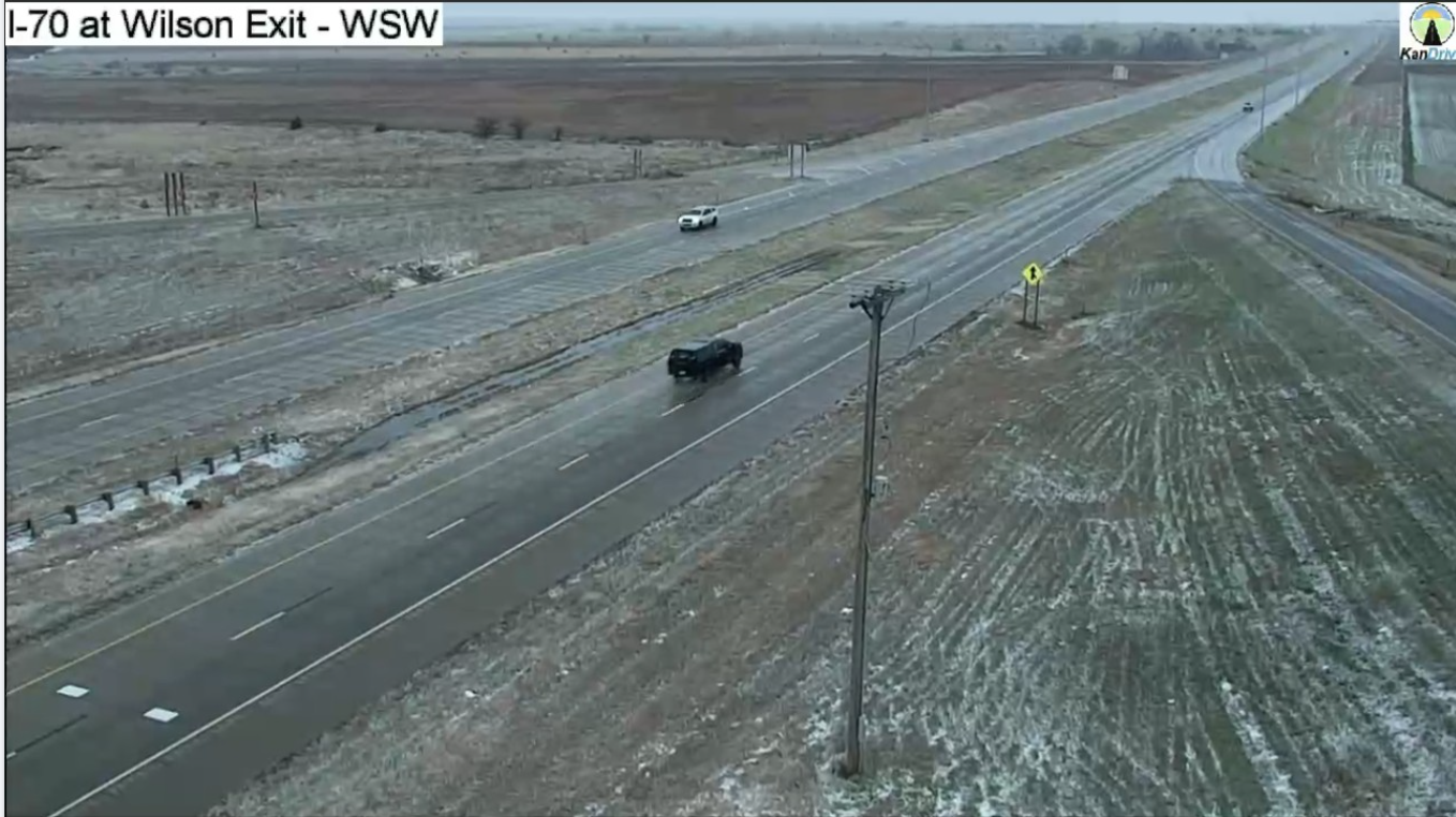Minor accumulations on grassy surfaces at the Wilson exit along I-70. Snow will come to an end from west to east as we move through the morning hours. Photo from KDOT cameras