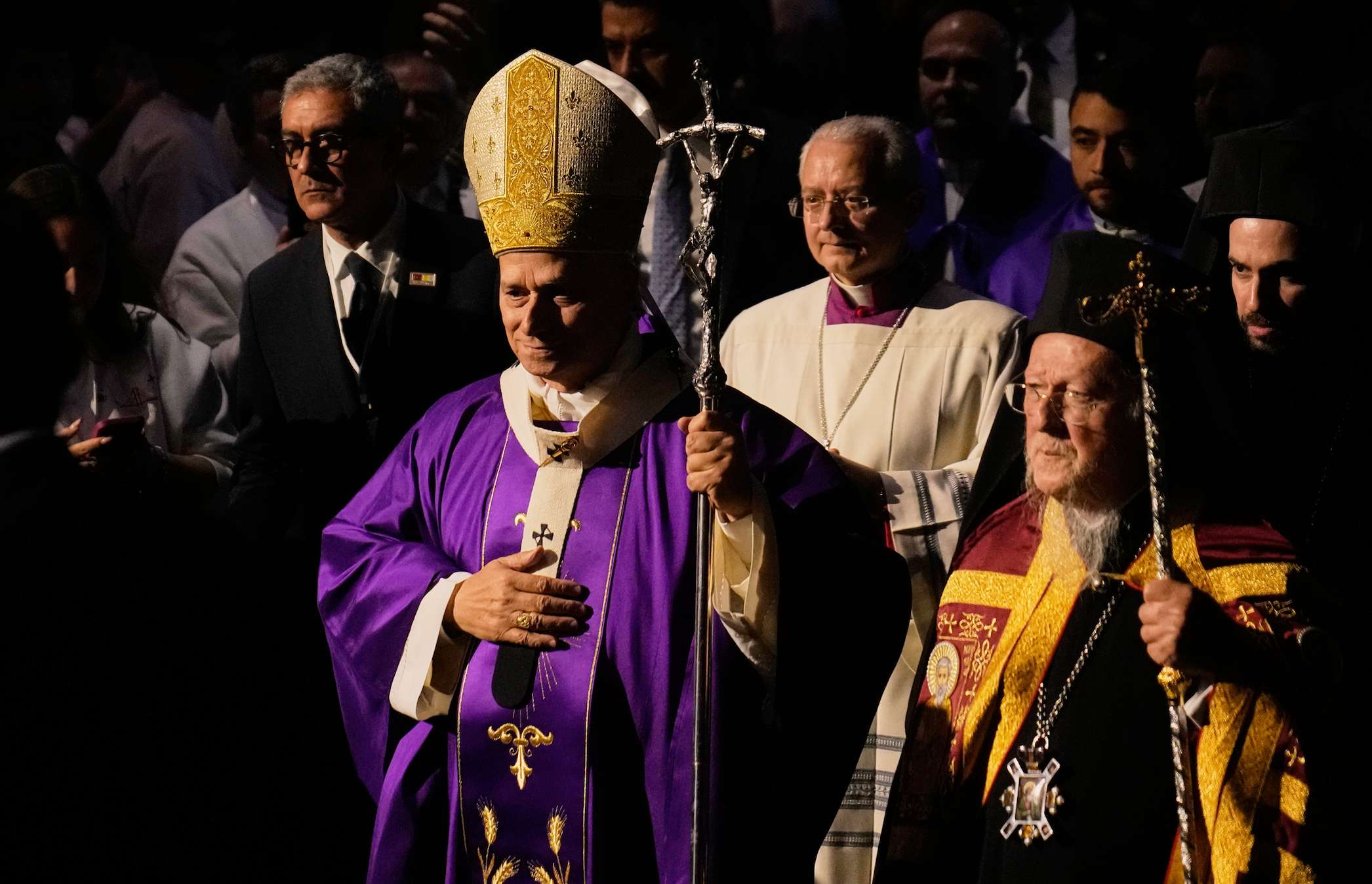Pope Leo XIV arrives with Ecumenical Patriarch Bartholomew I, the spiritual leader of the world's Eastern Orthodox Christians to celebrate a Mass at the Volkswagen Arena, in Istanbul, Turkey, Saturday, Nov. 29, 2025. (AP Photo/Khalil Hamra)