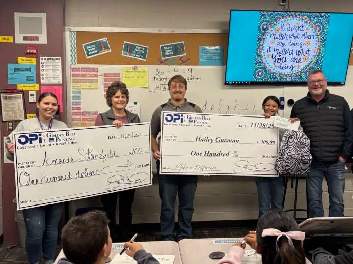 OPI & Golden Belt Printing handed out a pair of checks to Riley fifth grader Hailey Guzman and her teacher, Mandy Stansfield. Guzman was selected as the November winner in the Make a Difference Contest.