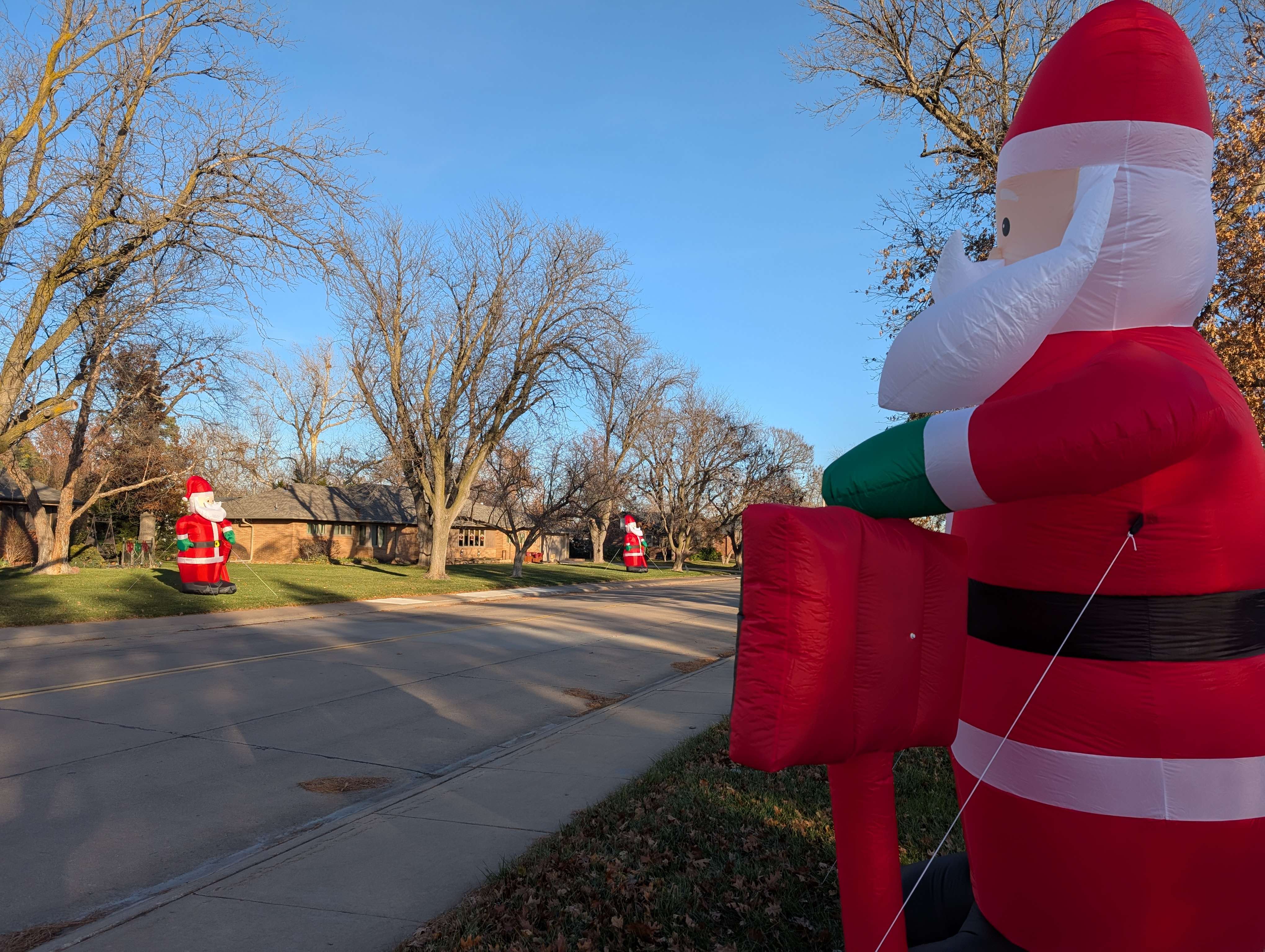Neighbors on 19th Street east of Veterans Lake have teamed up to add to the Christmas spirit with 24 giant inflatable Santas.&nbsp;