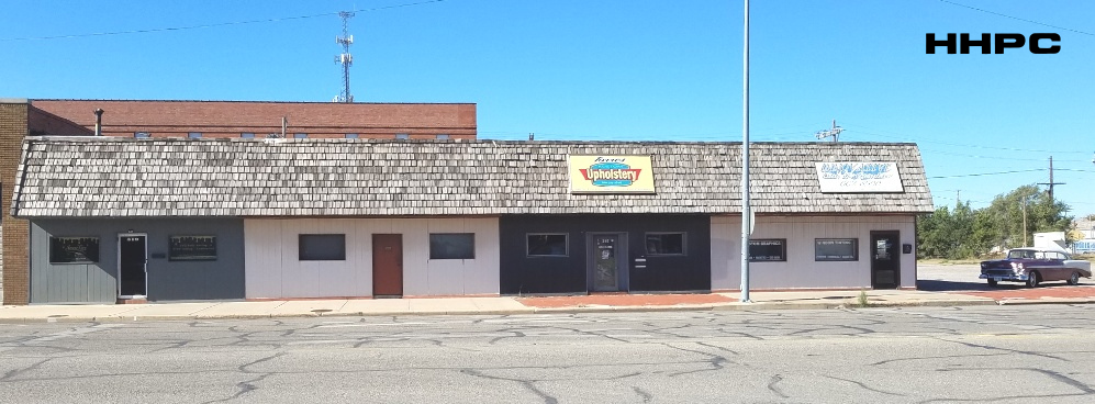 Blue Grill Cafe &amp; Ed Beach Electric - 319 through 313 S. Main - Swae'Lux-Torres Upholstery-Innovative Tint - 319-313 S. Main - Nov. 2, 2025. Courtesy of the Conard-Harmon Collection.