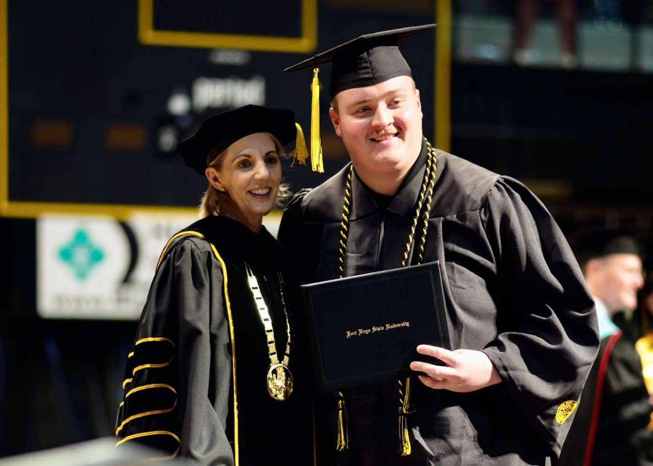 Fort Hays State University President Tisa Mason with a graduate at the commencement ceremony. Courtesy photo