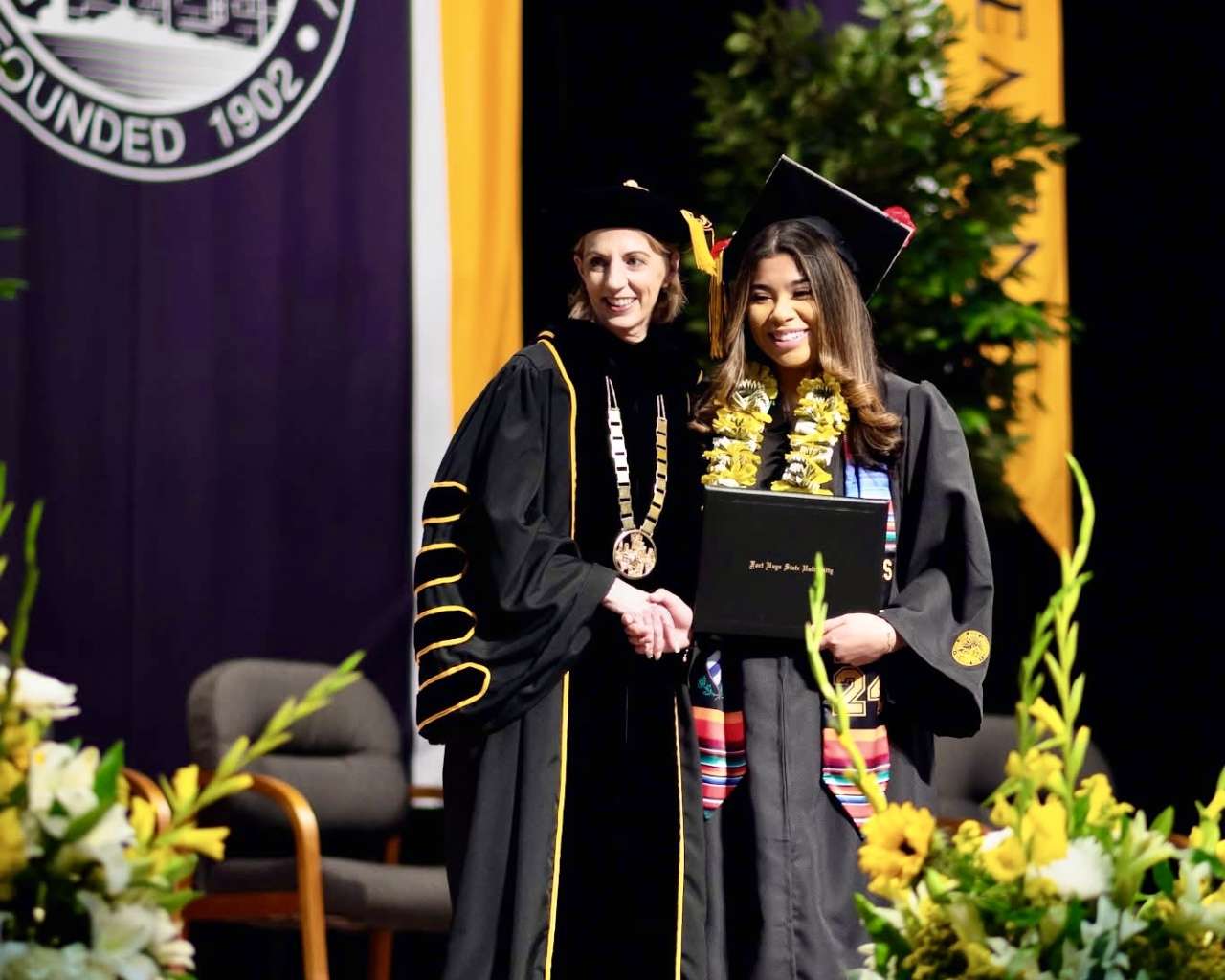 Fort Hays State University President Tisa Mason with a graduate at the commencement ceremony. Courtesy photo