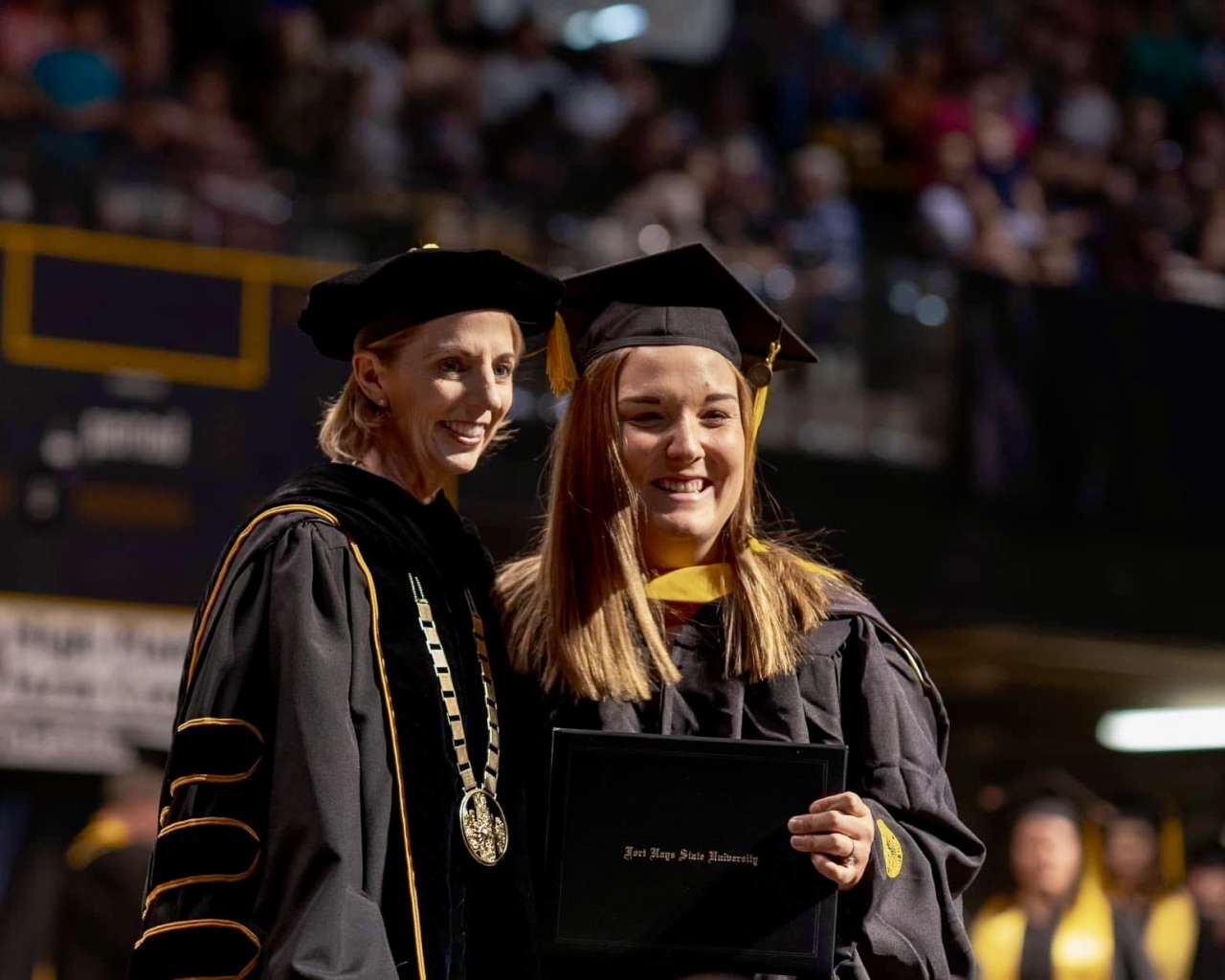 Fort Hays State University President Tisa Mason with a graduate at the commencement ceremony. Courtesy photo