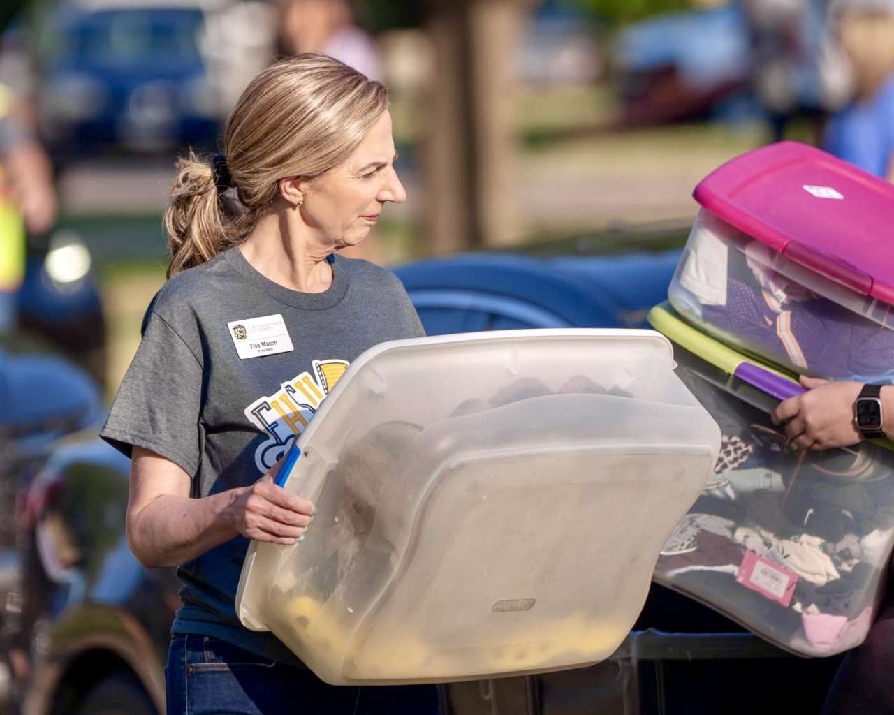 Fort Hays State University President Tisa Mason helping students move into residential halls for the 2025 fall semester. Courtesy photo