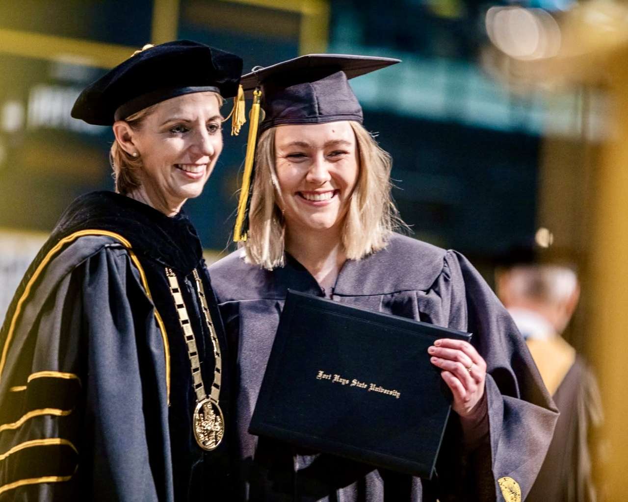 Fort Hays State University President Tisa Mason with a graduate at the commencement ceremony. Courtesy photo