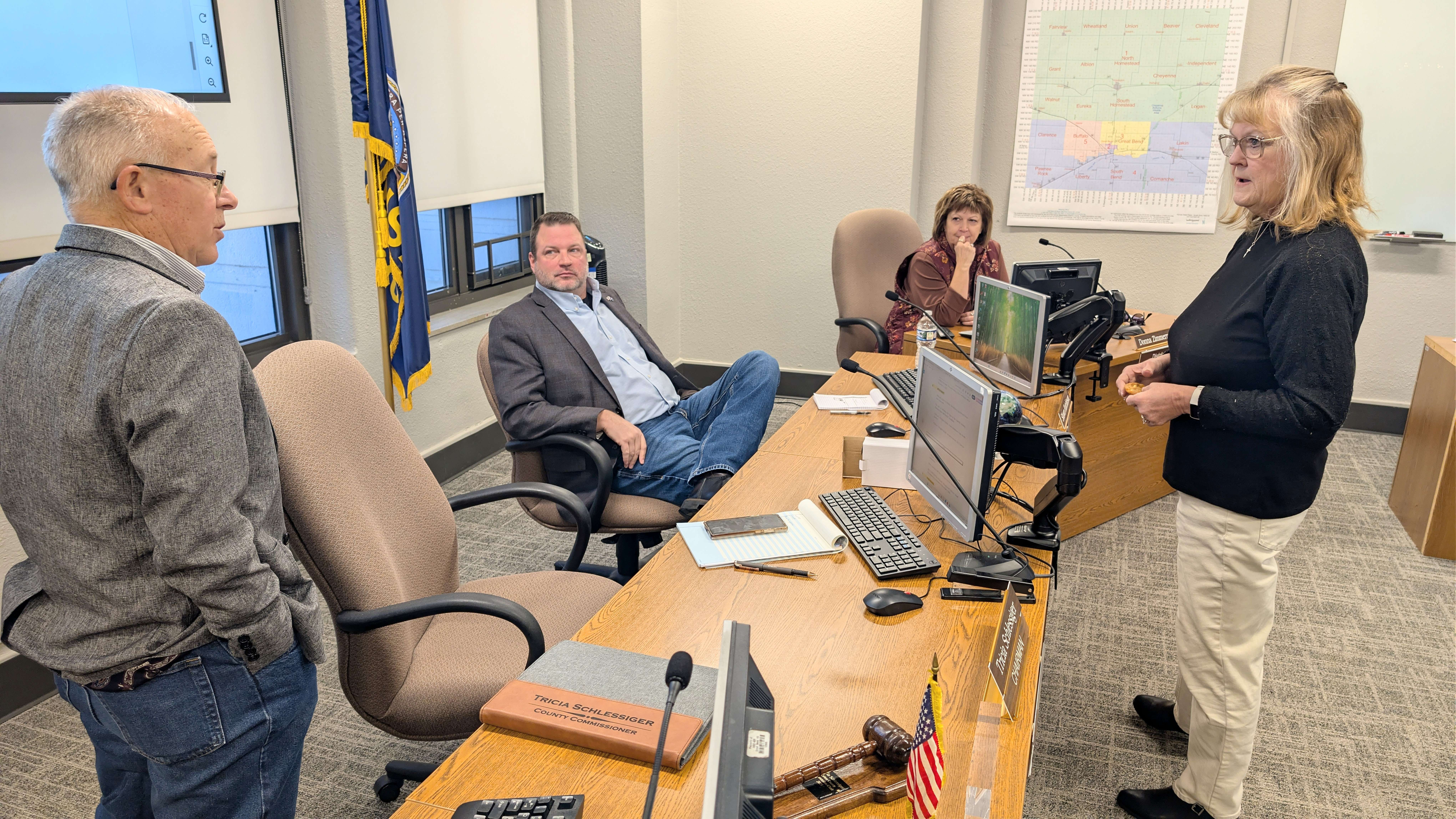 Barton County commissioners Duane Reif, Shawn Hutchinson, Donna Zimmerman and Barb Esfeld discuss the newly Approved Wind Energy Conversion System regulations following the agenda meeting Tuesday morning.