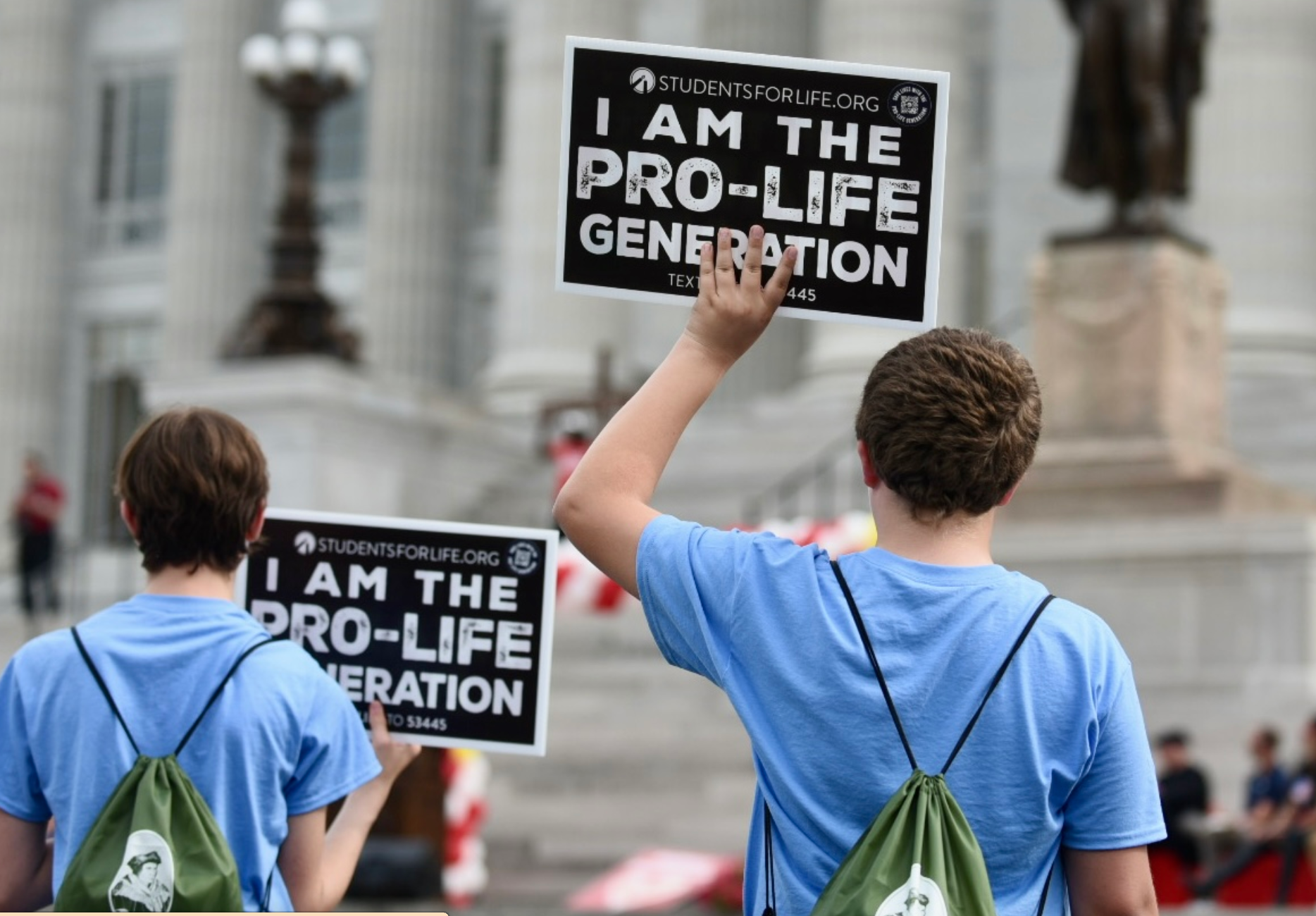 Students hold up anti-abortion signs at the Midwest March for Life on May 1, 2024, at the Missouri State Capitol (Anna Spoerre/Missouri Independent).