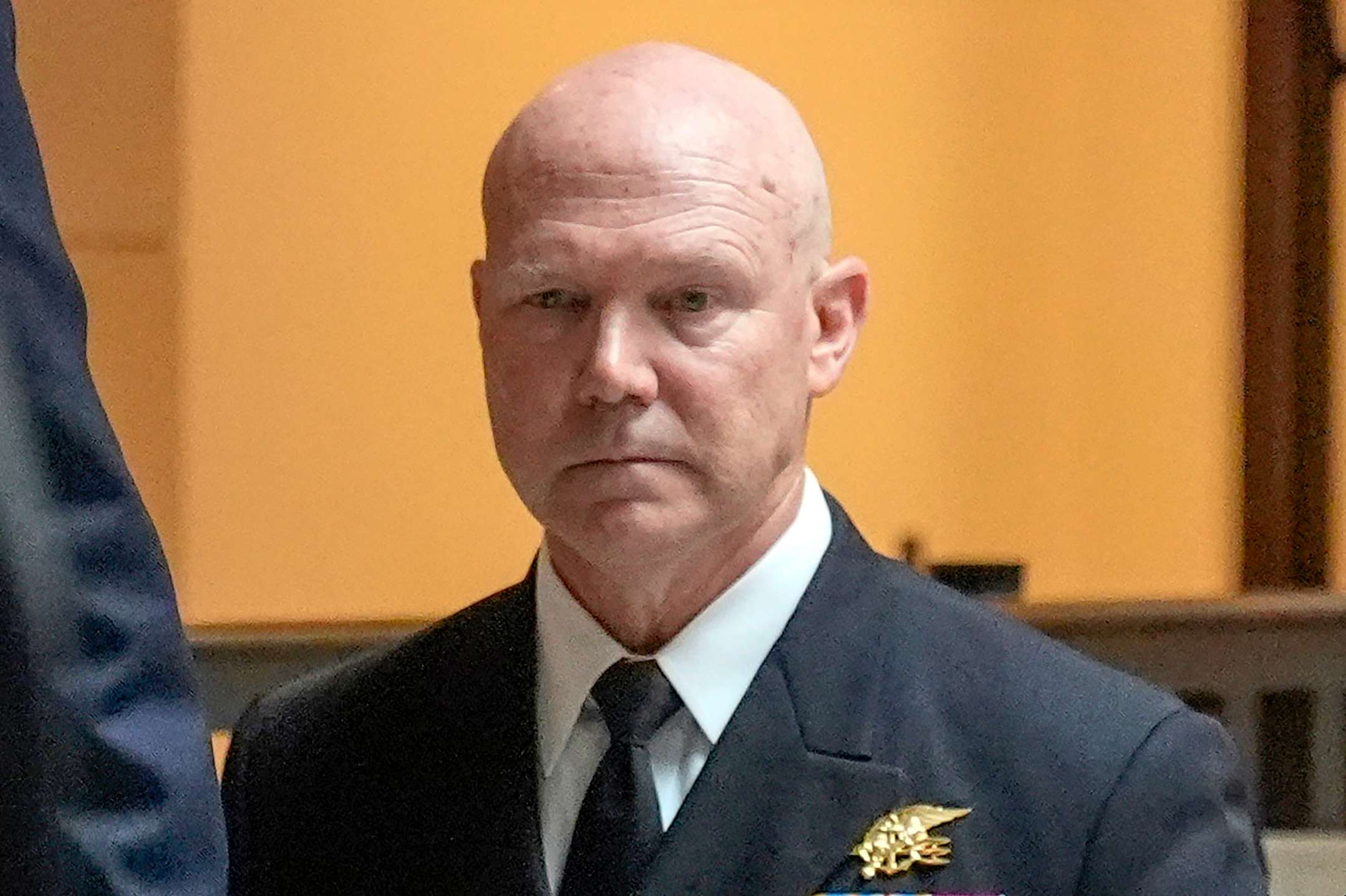 U.S. Navy Adm. Frank M. Bradley walks to a meeting with senators on Capitol Hill, Thursday, Dec. 4, 2025, in Washington. (AP Photo/Mark Schiefelbein)