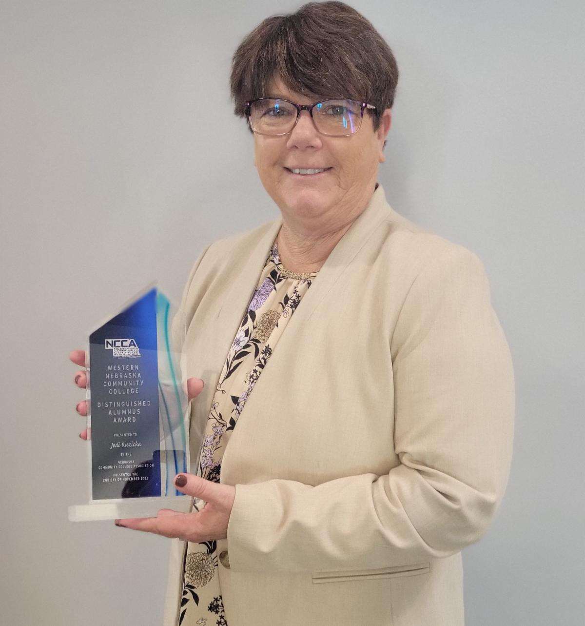 Jodi Ruzicka, Class of 1995, was presented with the 2025 Distinguished Alumni at the 2025 NCCA Conference.