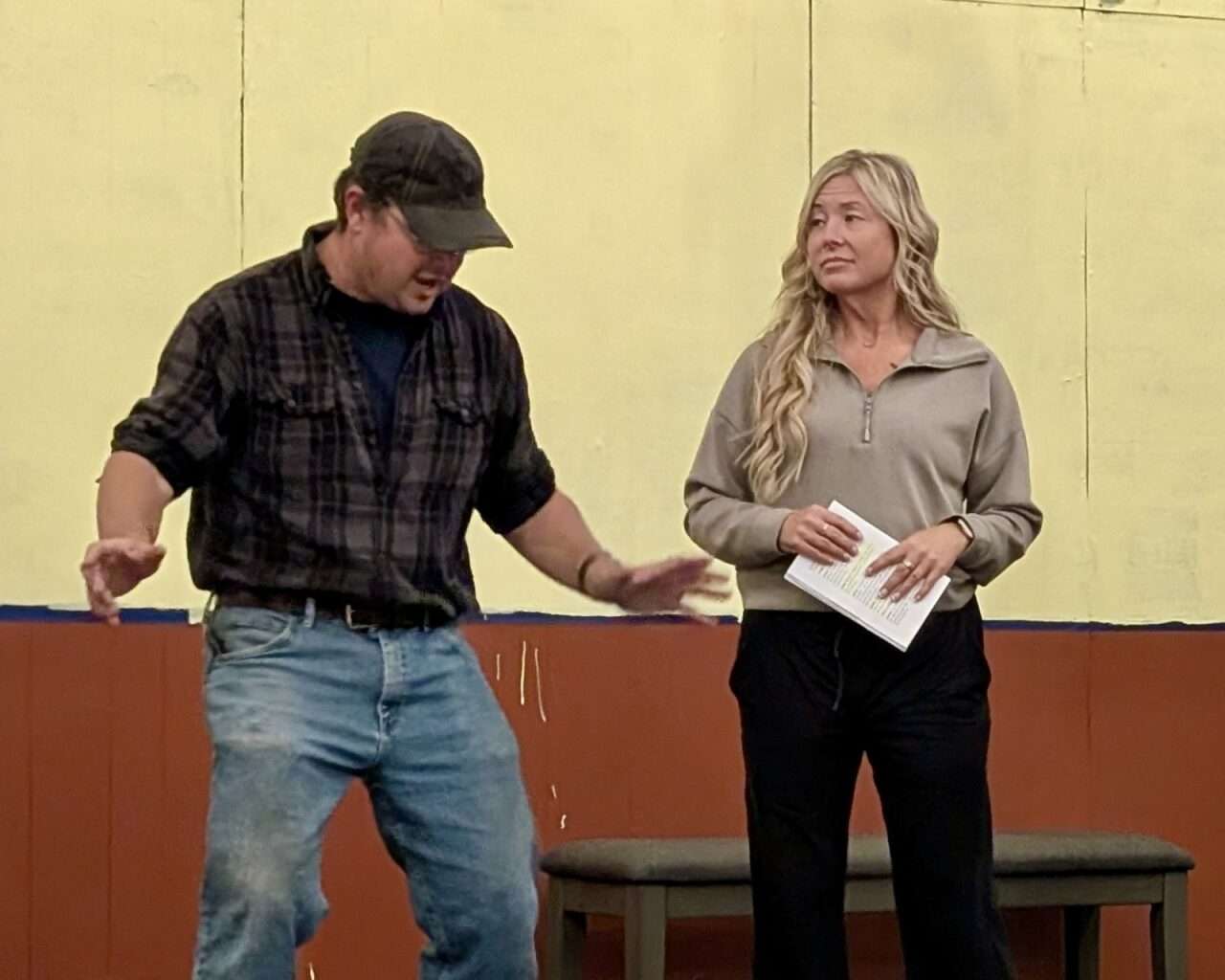 Jerrett Leiker, as Justice, an actor in the "show," attempts to show Jenni Wittkorn, as Selena, an actor in the "show," ways to calm her nerves on stage. Courtesy Hays Community Theatre