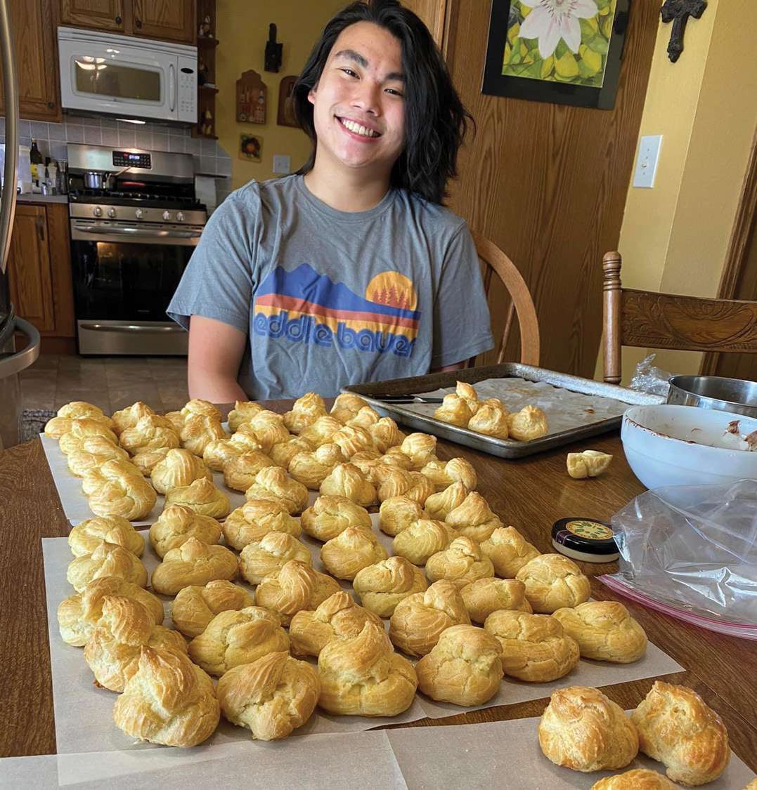Andy's youngest son, Gabe, with cream puffs. When Gabe was in middle school, he and his dad spent a summer learning new recipes together. Cream puffs was one of the recipes Gabe wanted to learn. Courtesy photo