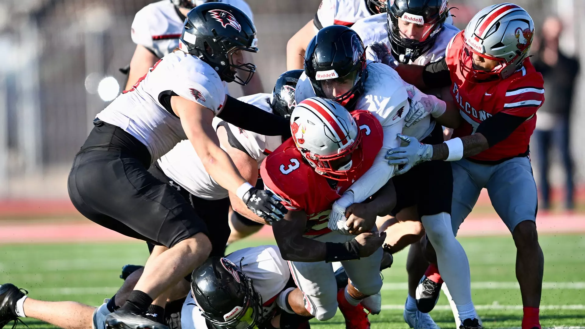 The Benedictine Ravens defense takes downs Friends University quarterback K'Vonte Baker during the Ravens 24-18 win on Saturday. Benedictine advances to their second consecutive NAIA Semifinals appearance next week against Grandview/ Photo courtesy of Todd Nugent-Benedictine Athletics