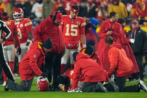 Kansas City Chiefs offensive lineman Wanya Morris is assisted after being injured during the first half of an NFL football game against the Houston Texans Sunday, Dec. 7, 2025, in Kansas City, Mo. (AP Photo/Charlie Riedel)