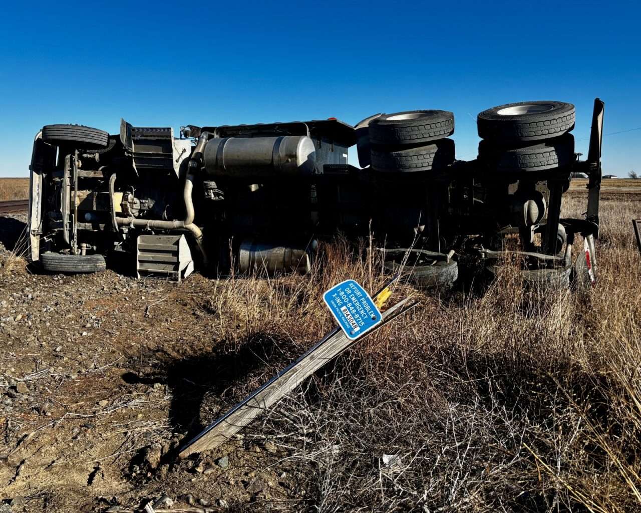 A flipped semi-truck after a train collision at Vincent Road and Old Highway 40 east of Victoria. Photo by Tony Guerrero/Hays Post