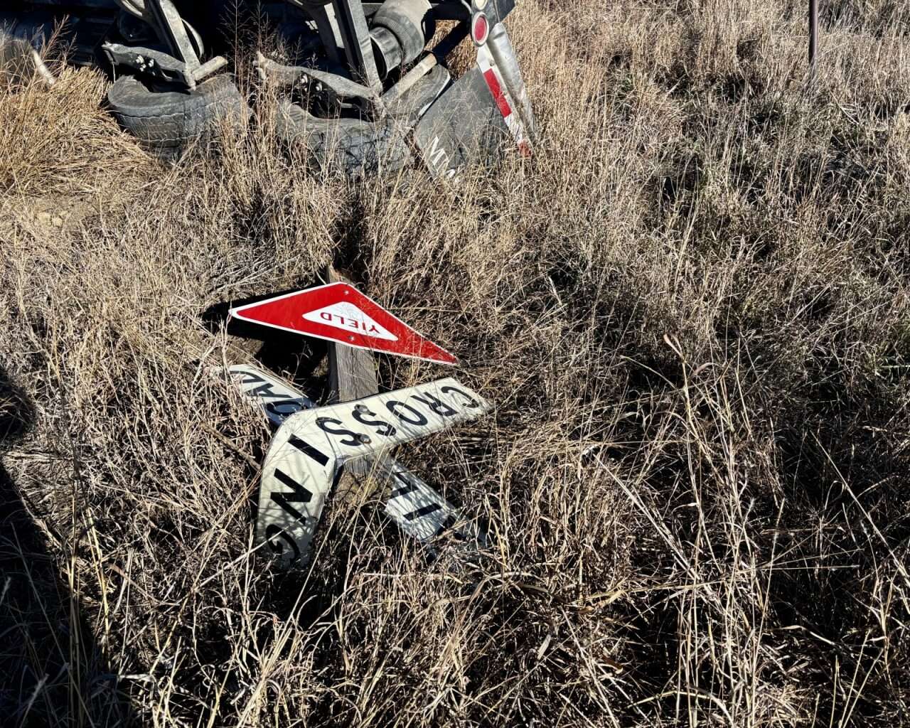 Damaged road signs at Vincent Road and Old Highway 40 east of Victoria. Photo by Tony Guerrero/Hays Post