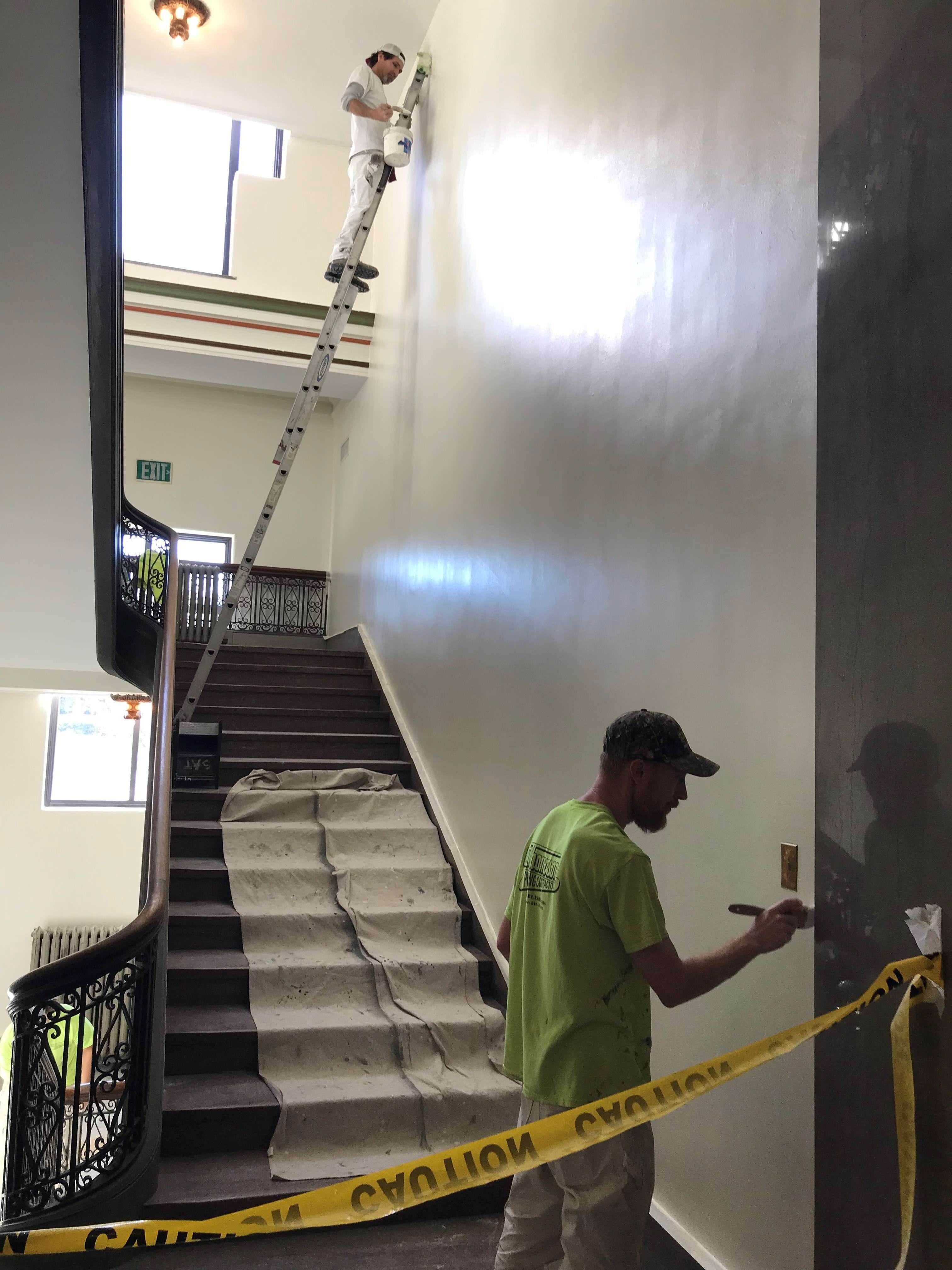 Painters put on a fresh coat of paint inside City Hall/Photo by Brent Martin