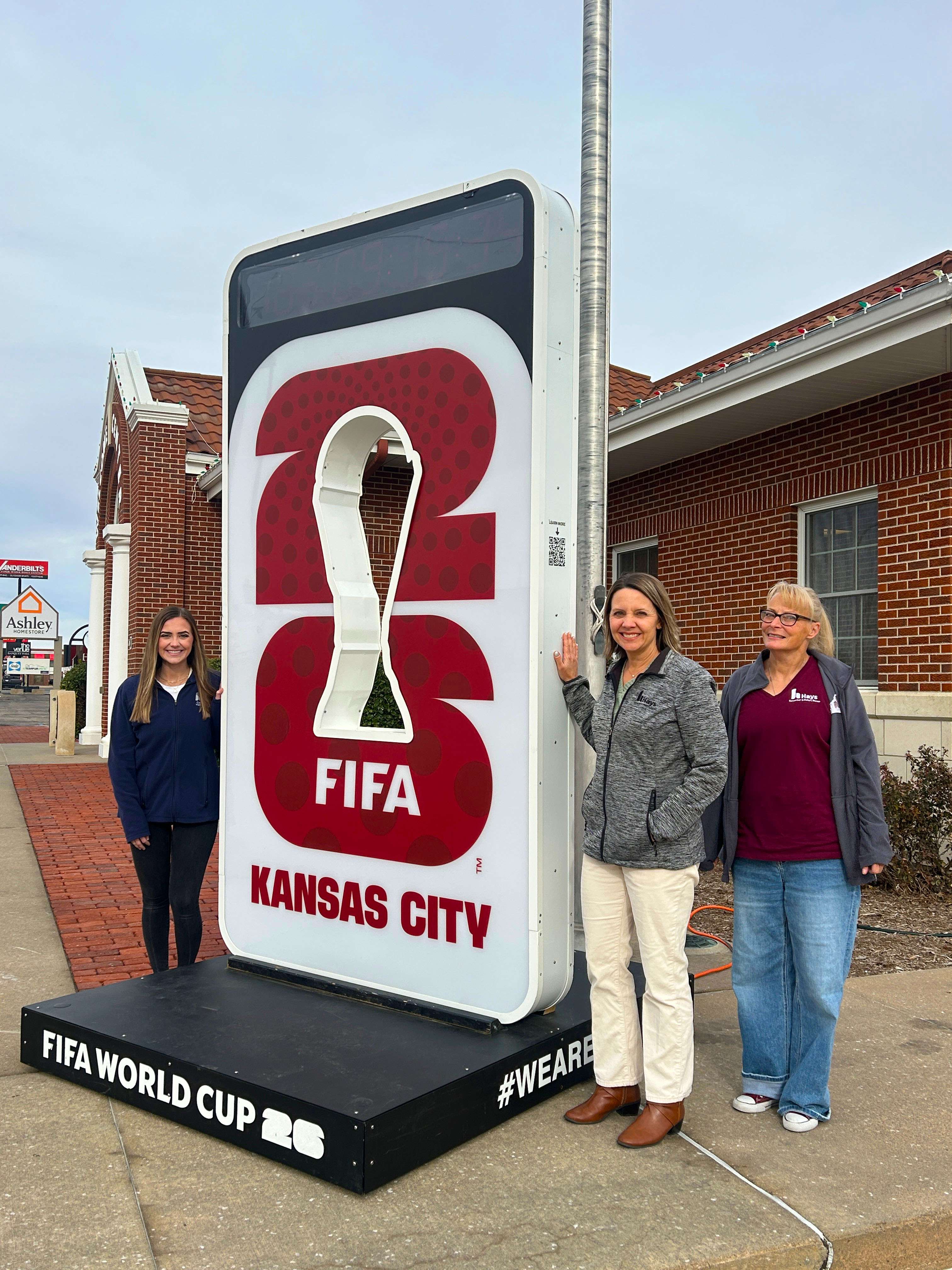 FIFA World Cup Clock and Hays CVB staff members Kyrsten Feik, Melissa Dixon and Jenni Rajewski. Courtesy photo