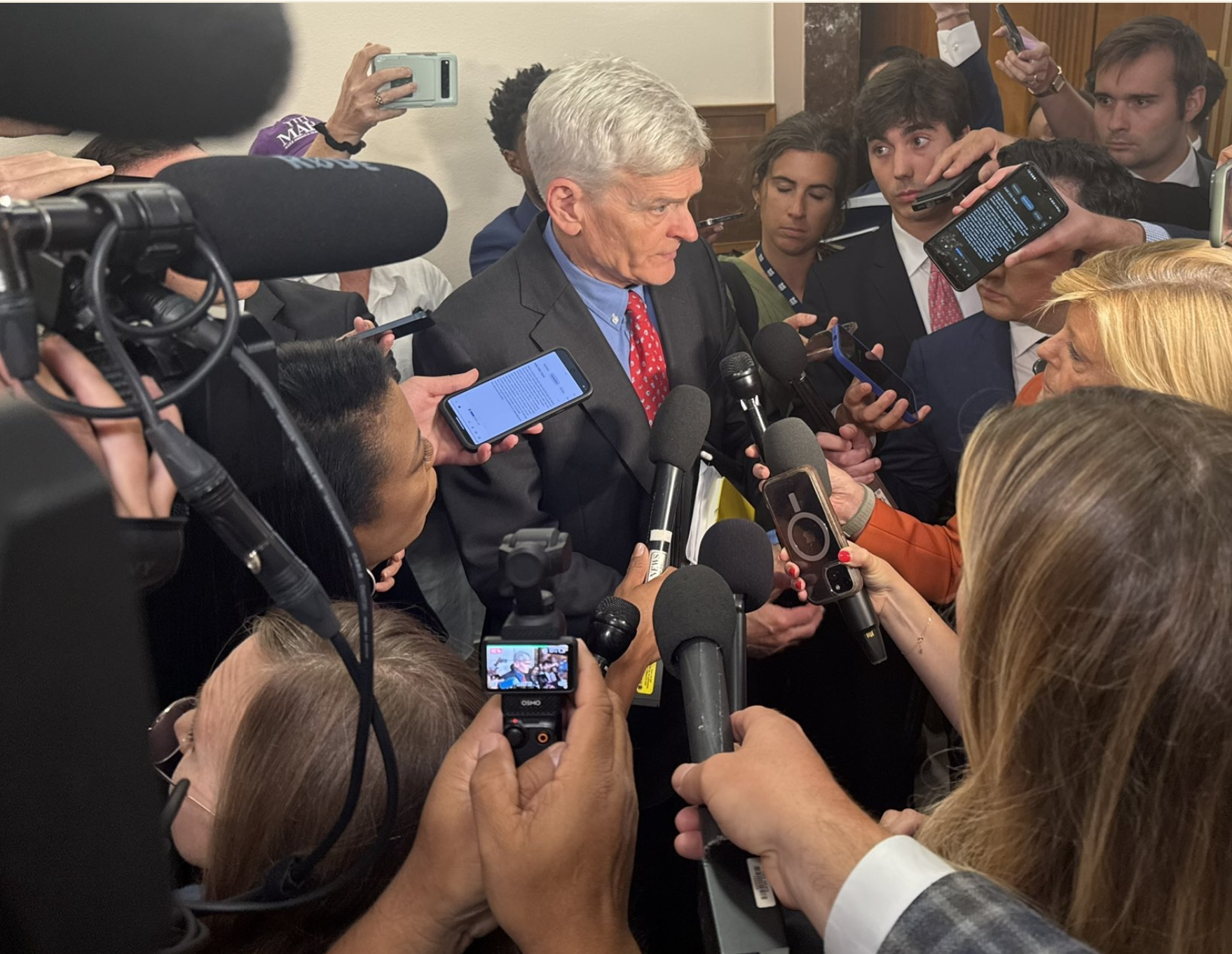 Sen. Bill Cassidy, R-La., answers questions from reporters after chairing a hearing of the Senate Health, Education, Labor and Pensions Committee on Sept. 17 (Jennifer Shutt/States Newsroom).