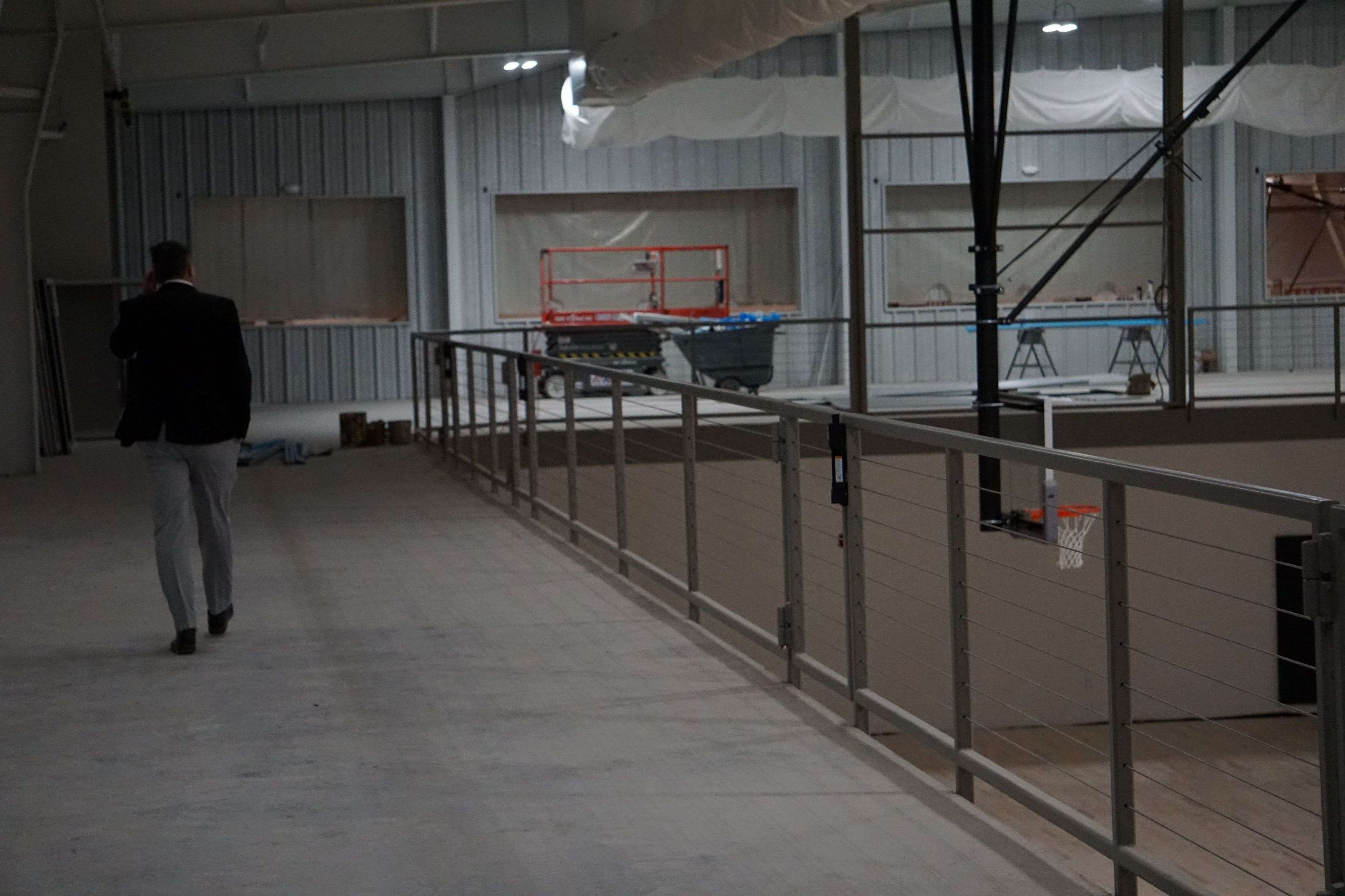 St. Joseph Co-Superintendent, Danny Maggart, walks along the walkway of the new gym/Photo by Brent Martin