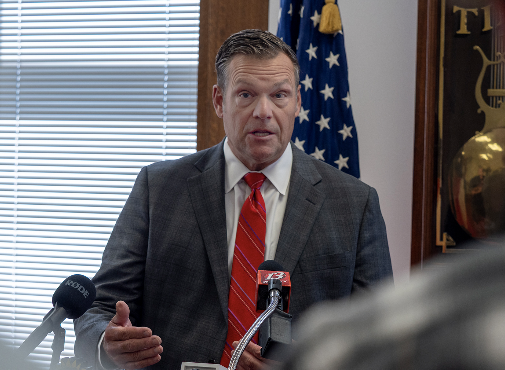 Kansas Attorney General Kris Kobach wrote demand letters to three Kansas cities, giving them 60 days to repeal their bans on conversion therapy for&nbsp; minors. He appears here at a press conference on Oct. 1, 2025. (Photo by Sherman Smith/Kansas Reflector)