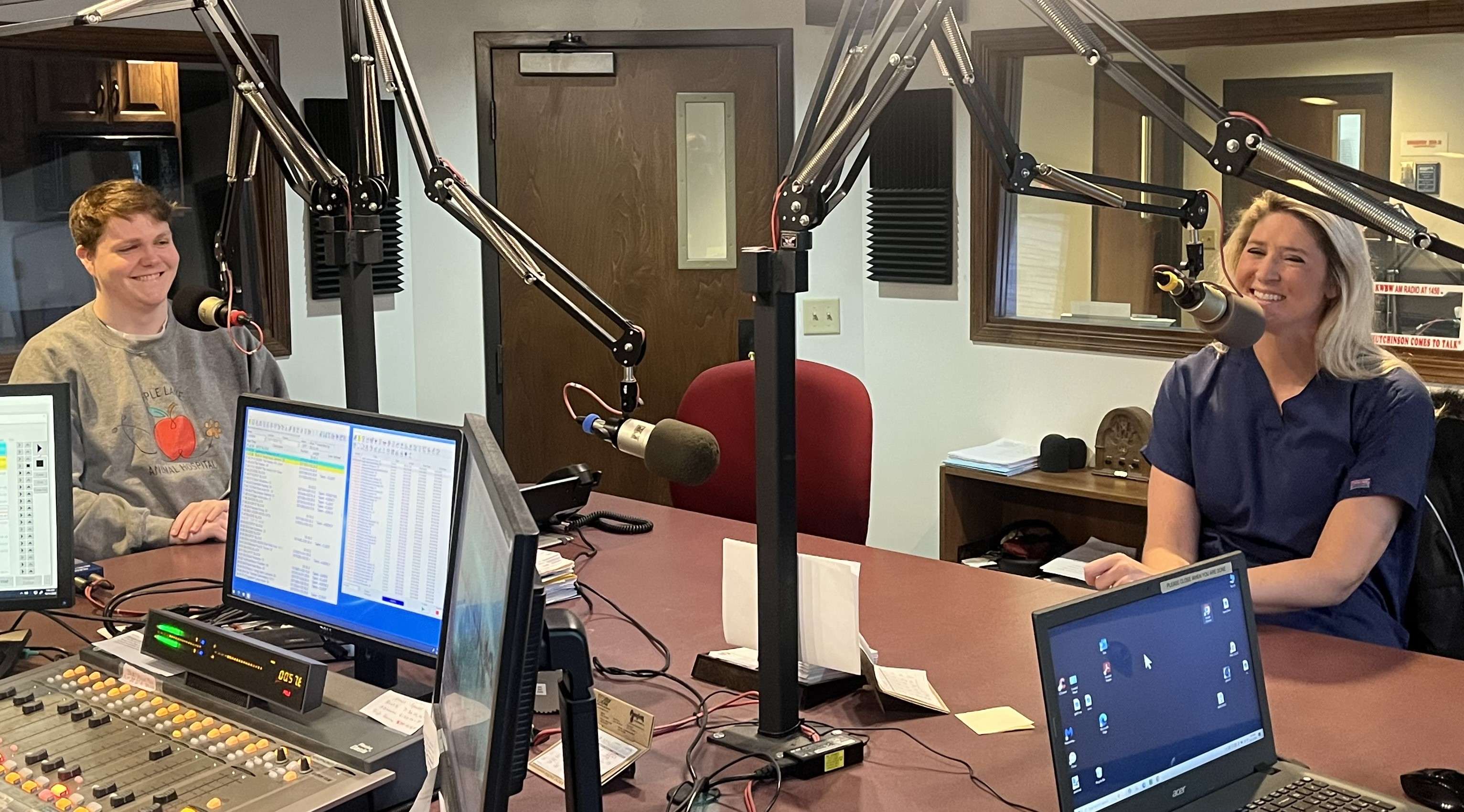 Dr. Logan Druecker (L) and Dr. Erica Miller (R) of Apple Lane Animal Hospital