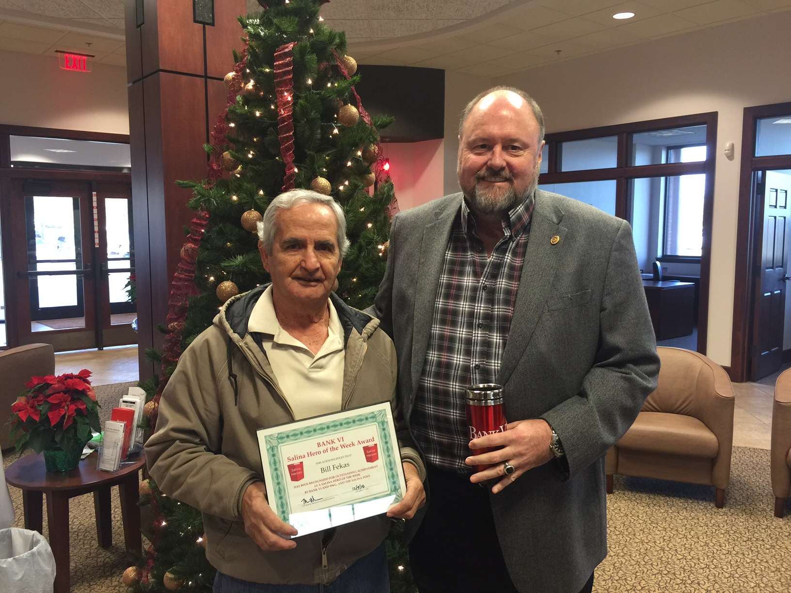 Bill Fekas receives "Hero of the Week" award from former Bank VI (now Bank of the Plains) President, Tom Wilbur back in 2014.