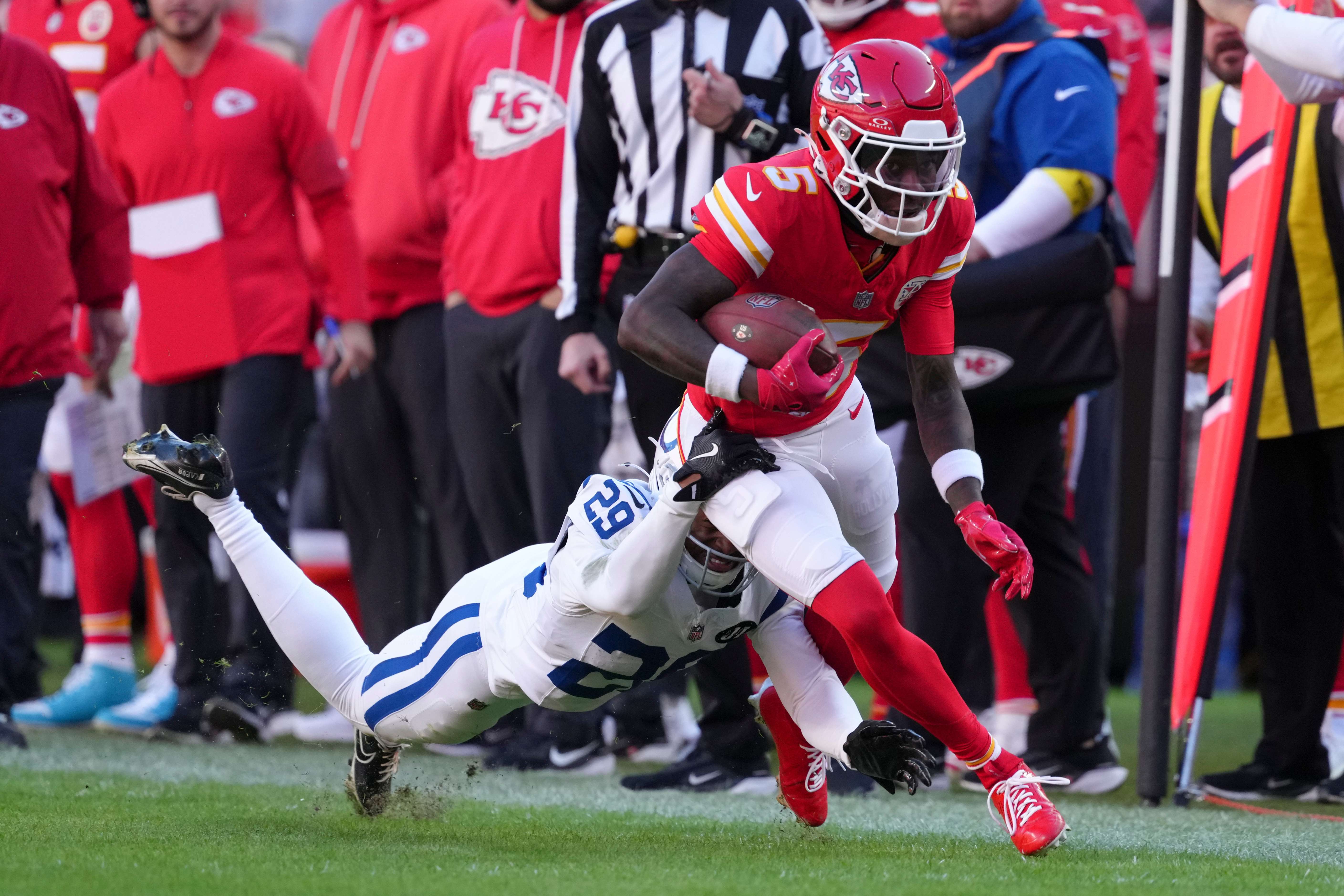 Kansas City Chiefs wide receiver Hollywood Brown (5) is tackled by Indianapolis Colts cornerback Mekhi Blackmon (29) during the second half of an NFL football game Sunday, Nov. 23, 2025, in Kansas City, Mo. (AP Photo/Ed Zurga)