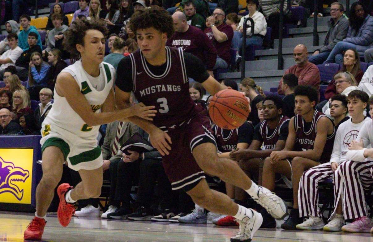 Kaeden Nienke drives to the basket during a close boys game. Photo by Kaiden Comeau.