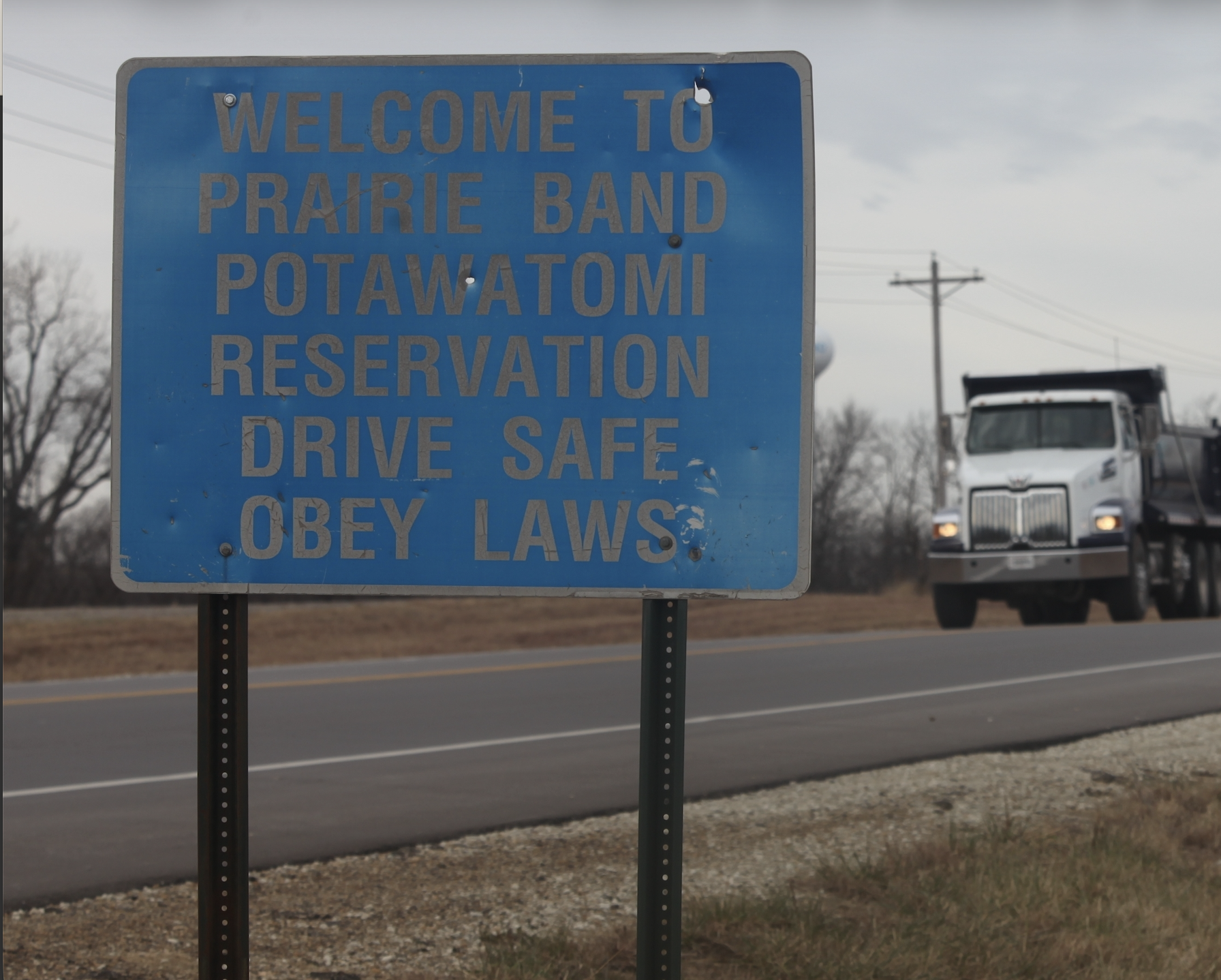 A sign on a road off of U.S. Highway 75 welcomes motorists to the Prairie Band Potawatomi reservation, outside Mayetta, Kan., Thursday, Dec. 11, 2025. (AP Photo/John Hanna)