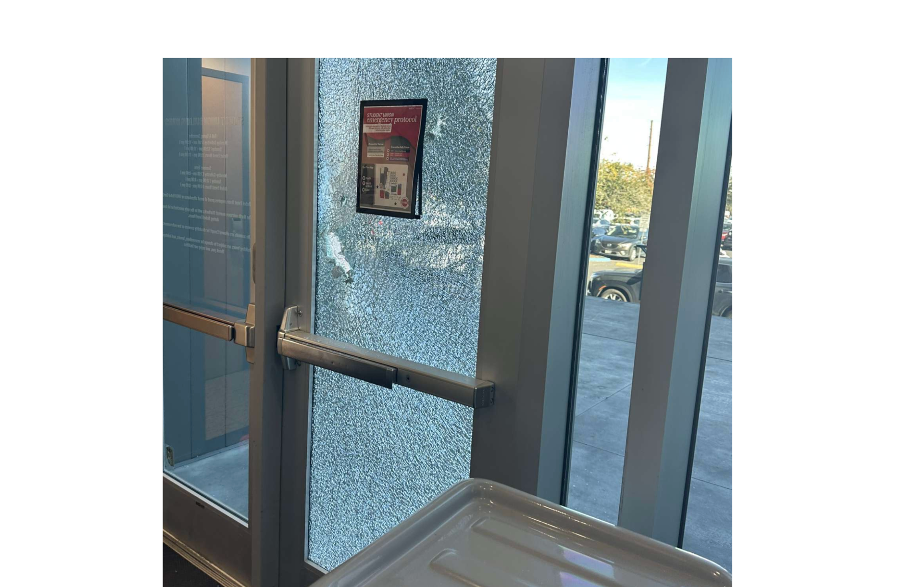 A glass door to the Student Union at UNLV is damaged from apparent gunfire. Las Vegas police say there are multiple victims and one suspect is dead-photo courtesy KSVN TV