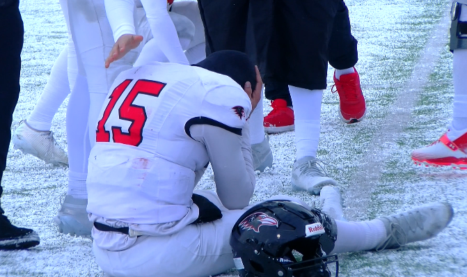 Benedictine senior quarterback Jackson Dooley was visibly upset after the Ravens fell to Grand View 17-10 in the NAIA Conference semifinals, the second consecutive year the Ravens fell in the semifinal round of the conference tournament/ Photo courtesy of Brett Kennedy-KQ2 Sports