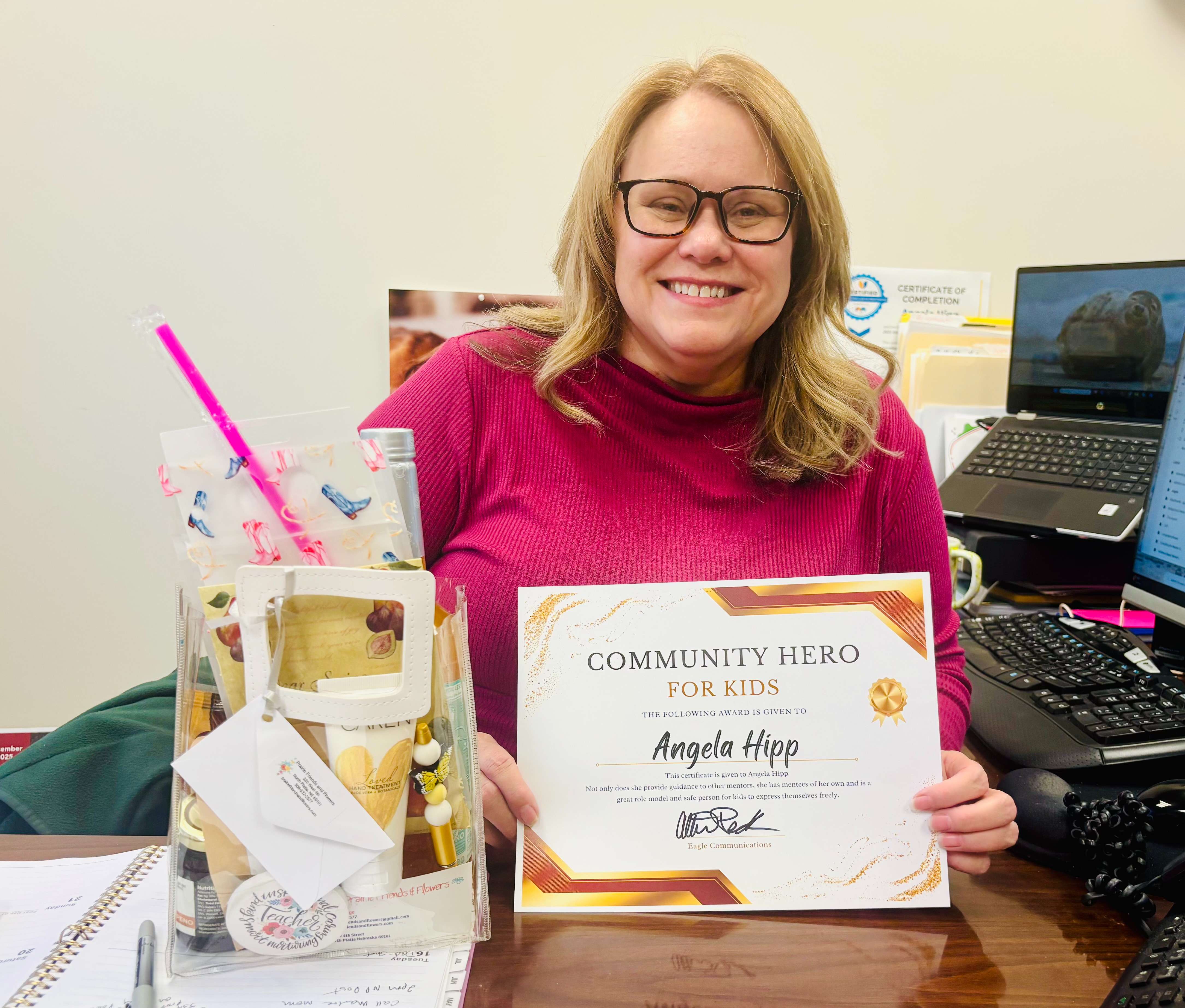 Angela Hipp Mentor Coordinator at Community Connections in North Platte, was awarded this month's Community Hero for Kids from the Post and Prairie Friends & Flowers. (Allison Peck|North Platte Post)
