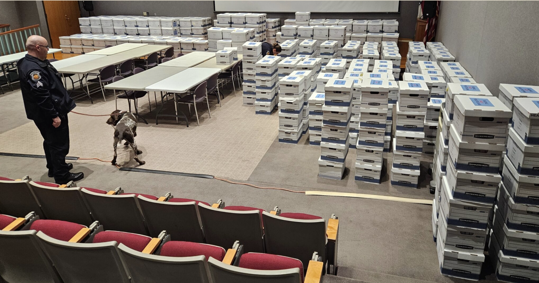  Missouri Capitol Police officers conduct security checks Dec. 9 on the 691 boxes of petitions filed to force a referendum on the gerrymandered Congressional district map passed by lawmakers in September. Of the 27 times a referendum has been placed on the Missouri ballot, voters have rejected the General Assembly’s actions all but twice (Rudi Keller/Missouri Independent).