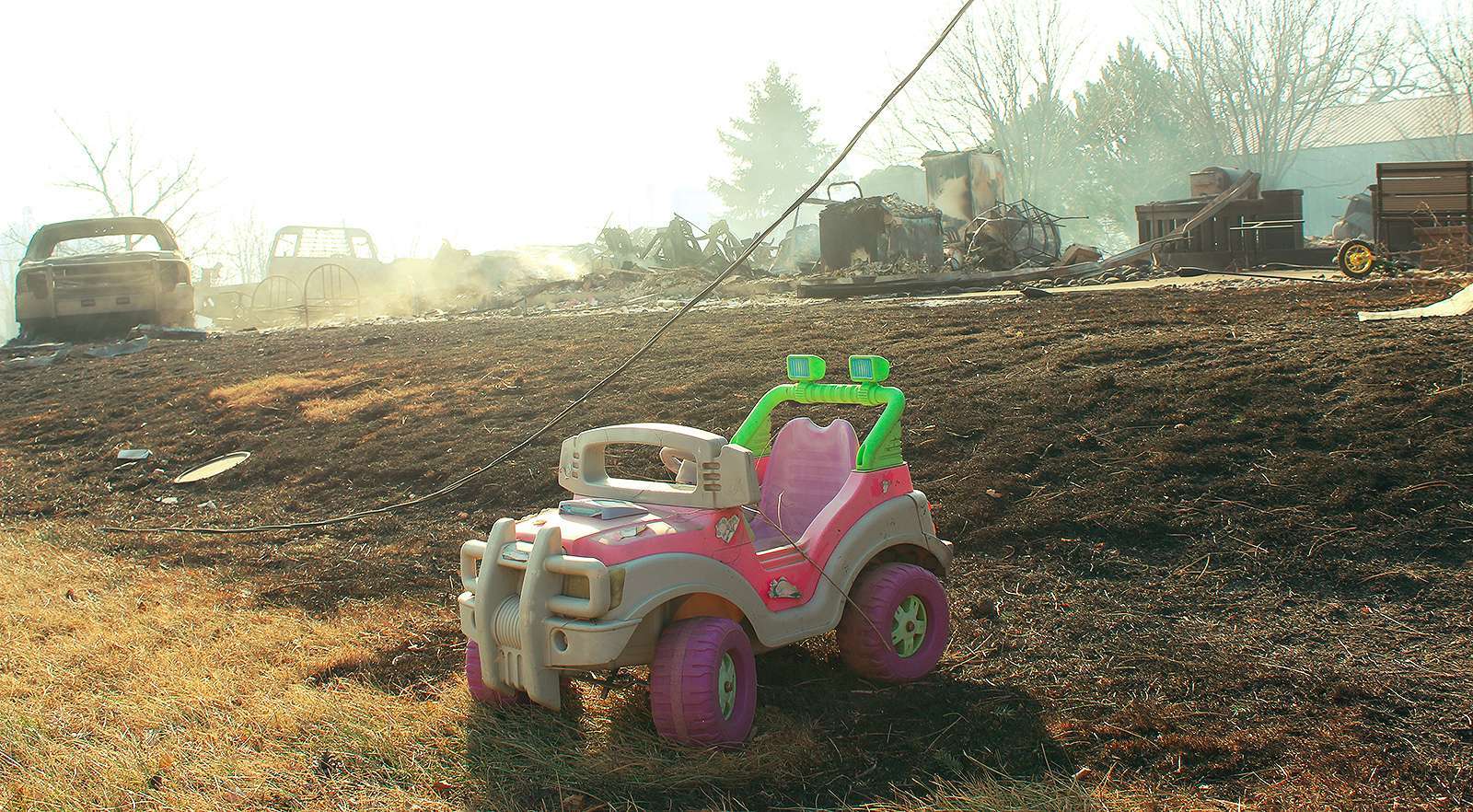 A child's toy is all that is left after a house in Paradise was burned to the ground as high winds ripped through Russell County during the Four County Fire. Photo by Cristina Janney/Hays Post