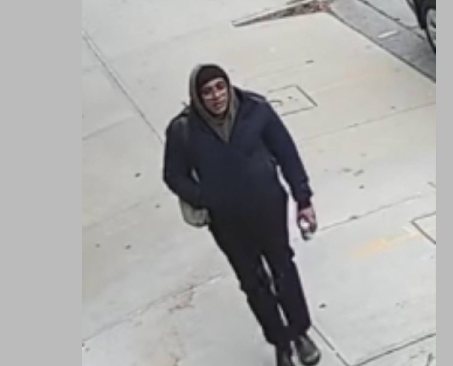 Providence police released this image of a person who walked by the person of interest on Saturday, Dec. 13, 2025. (Courtesy of Providence Police)