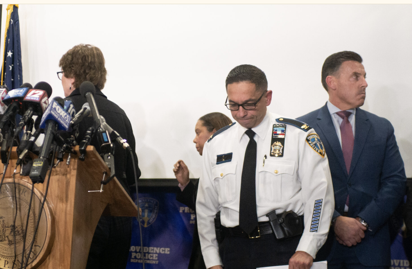 Providence Police Chief Col. Oscar Perez is shown at the right of the podium before the start of the press conference announcing the identify of the Brown University mass shooting suspect who was found dead in New Hampshire on Thursday, Dec. 18, 2025. (Photo by Alexander Castro/Rhode Island Current)