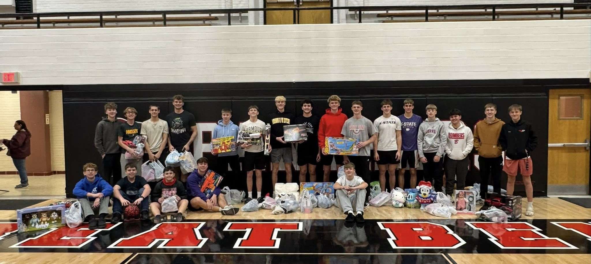 Members of the GBHS Boys Basketball team recently shopped for families in need this Christmas. (photos by Alex Birney)