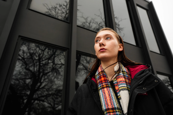 Caroline Siebels-Lindquist, shown above on Dec. 10, 2025, is a senior studying multimedia journalism at Drake University in Des Moines, Iowa. She dreams of being a columnist. Siebels-Lindquist, who will graduate in the spring, says she is concerned about the job market but is trying to stay positive. Lucius Pham/Iowa Public Radio
