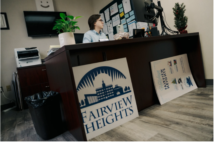 Ryan Jenkins, the economic development coordinator for the city of Fairview Heights, Illinois, answers emails on Dec. 10, 2025, at City Hall. Jenkins is a St. Louis University graduate. Brian&nbsp;Munoz / St. Louis Public Radio