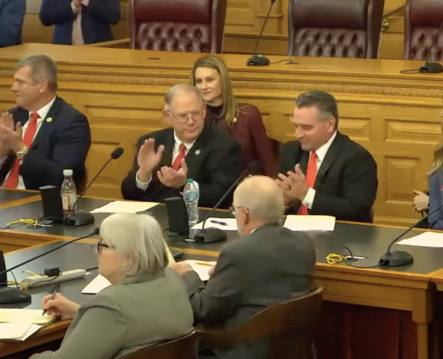 Kansas House Speaker Dan Hawkins and Kansas Senate President Ty Masterson applaud after the unanimous vote Monday afternoon -image from the Kansas Legislature YouTube page